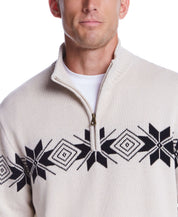 Model wearing a beige Snowflake Quarter Zip Sweater with black geometric patterns, suitable for holidays and casual occasions.