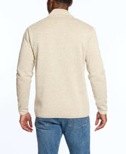 Back view of a man wearing a stone colored sweaterfleece pullover with sherpa, ideal for warmth and layering.