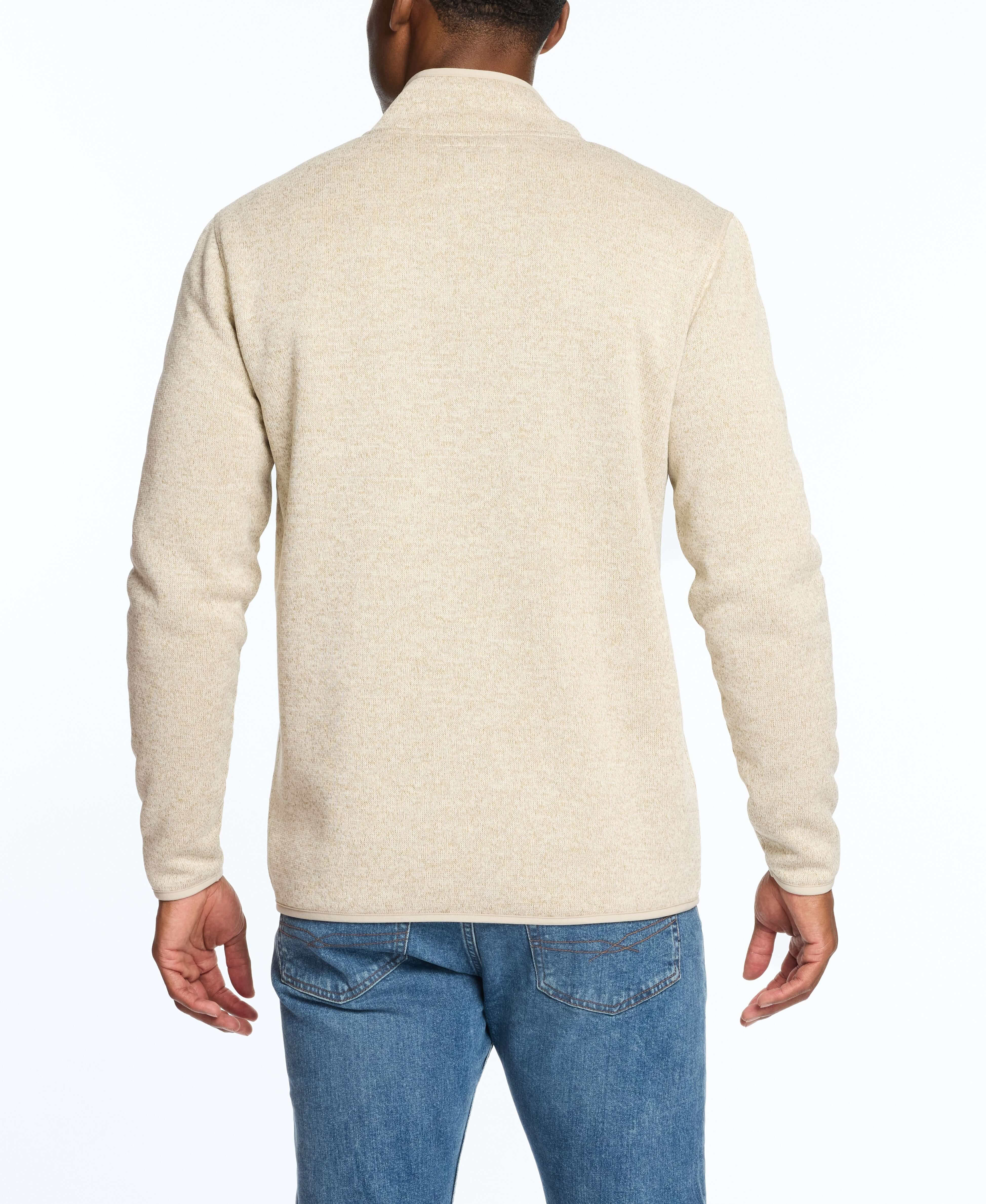 Back view of a man wearing a stone colored sweaterfleece pullover with sherpa, ideal for warmth and layering.