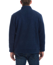 Back view of a man wearing a Teddy Sherpa pullover in Pageant Blue, showcasing its plush fleece fabric.
