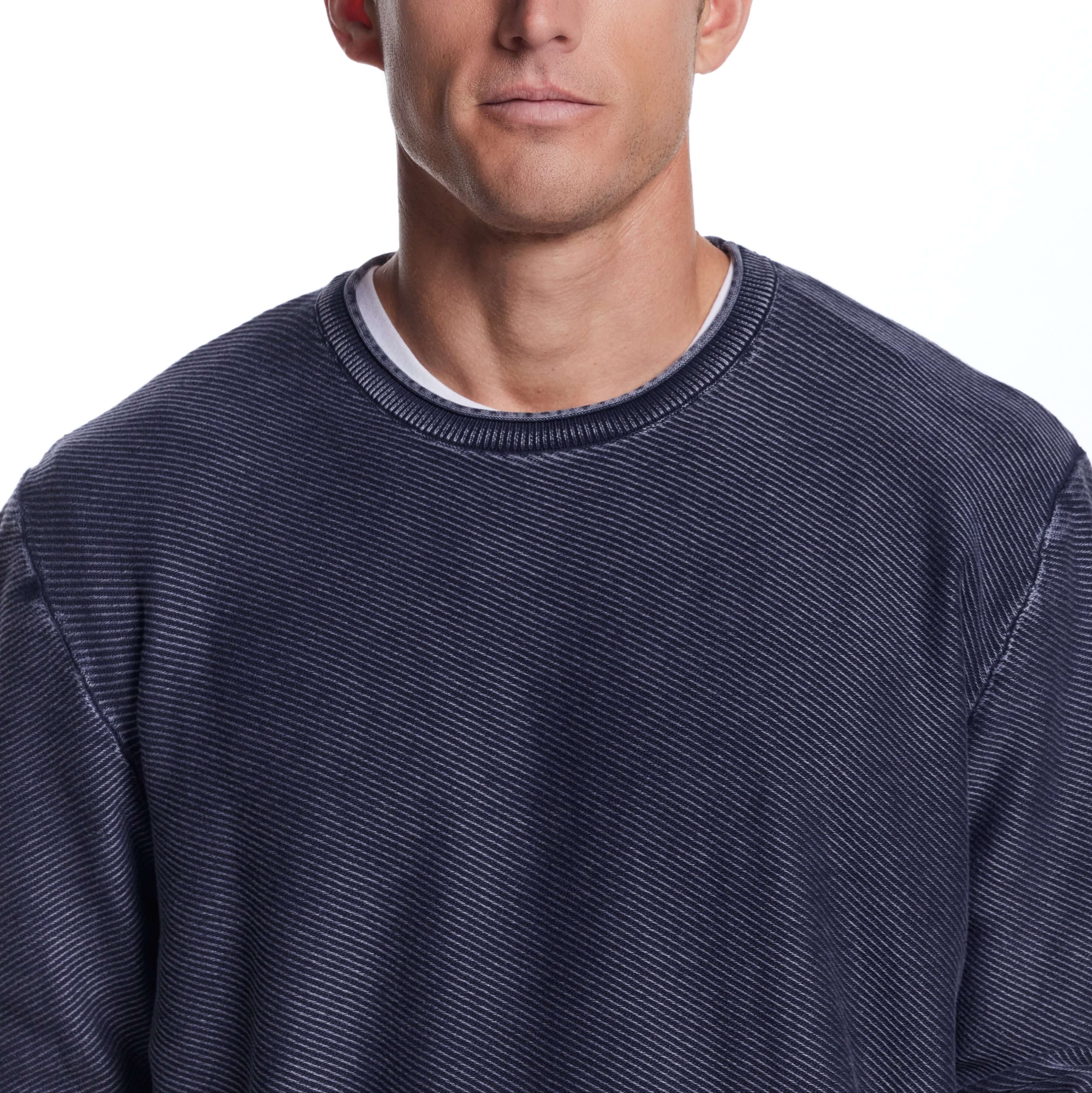 Twill Stonewash Sweater in Blue Nights, featuring a classic roll-neck design and airy twill stitch for a textured look.