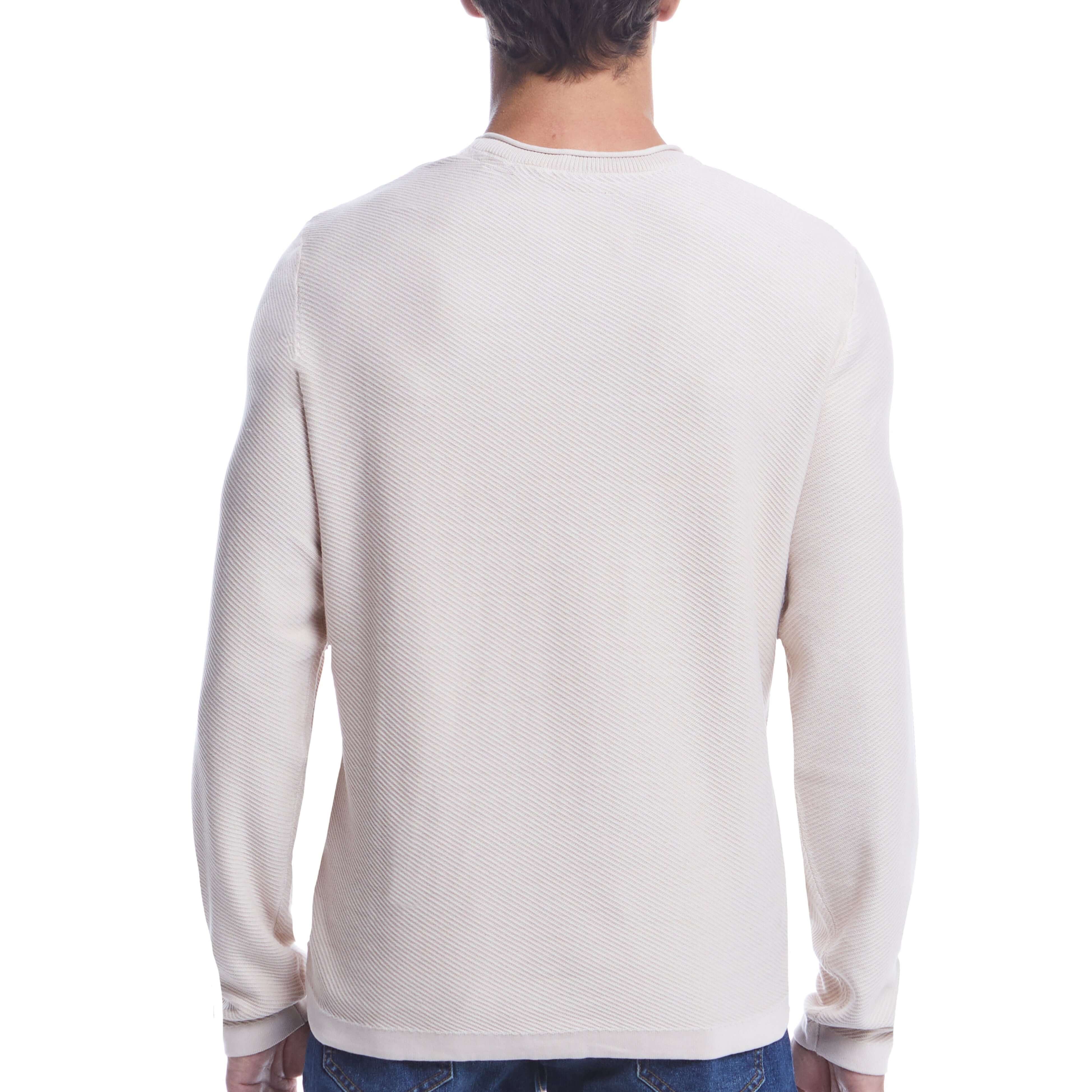 Back view of the Twill Stonewash Sweater in Natural, showcasing its airy texture and classic roll-neck design.