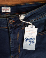 Close-up of Weather Soft Denim jeans featuring original label and comfy stretch fit design.