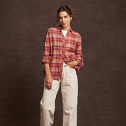 Casual women's orange stretch flannel shirt with a notch V-neck, button closure, and rolled cuffs for comfort.