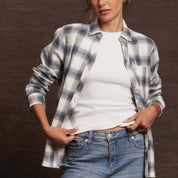 Women's blue and white plaid stretch flannel shirt featuring a classic fit, notch V-neck, and rolled long sleeves.