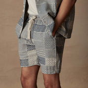 Men's 6" Jacquard shorts in cream and navy, featuring adjustable drawstring and side pockets, ideal for vacation wear.