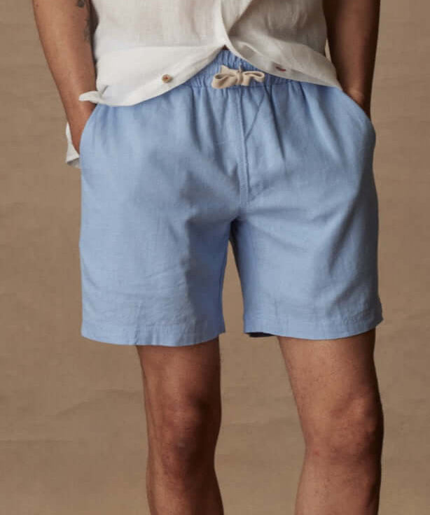 Breezy 7" linen shorts in fjord blue with adjustable drawstring and pockets.