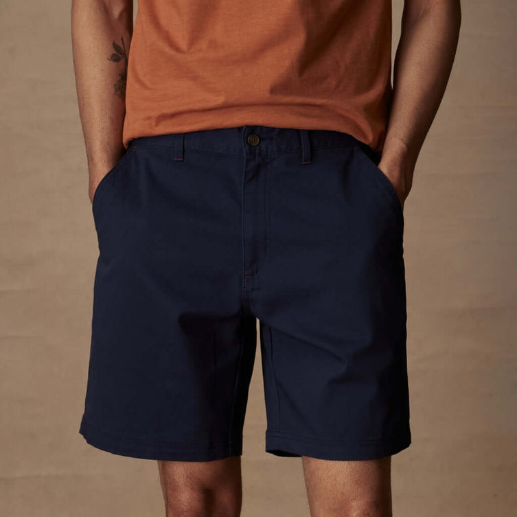 Men's 8" Peacoat Navy cotton twill shorts, featuring a flat front, belt loops, and side pockets for comfort and style.