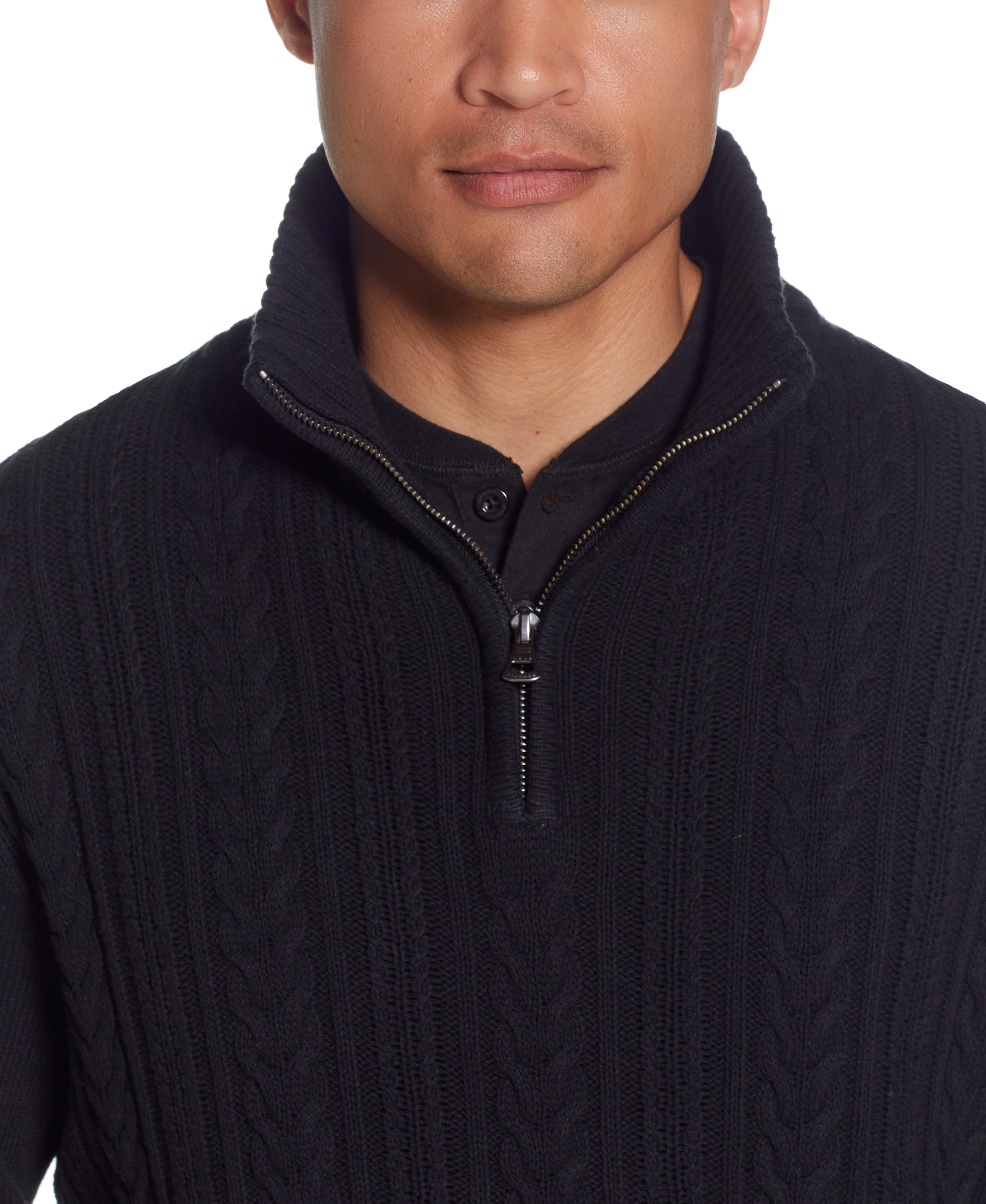 Close-up of a male model wearing a Cable Knit Quarter Zip Sweater In Black with a mock neck and quarter zip detail.