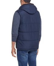 Sherpa Lined Hooded Puffer Vest In Dark Sapphire displayed on model from the back, highlighting the cozy design.