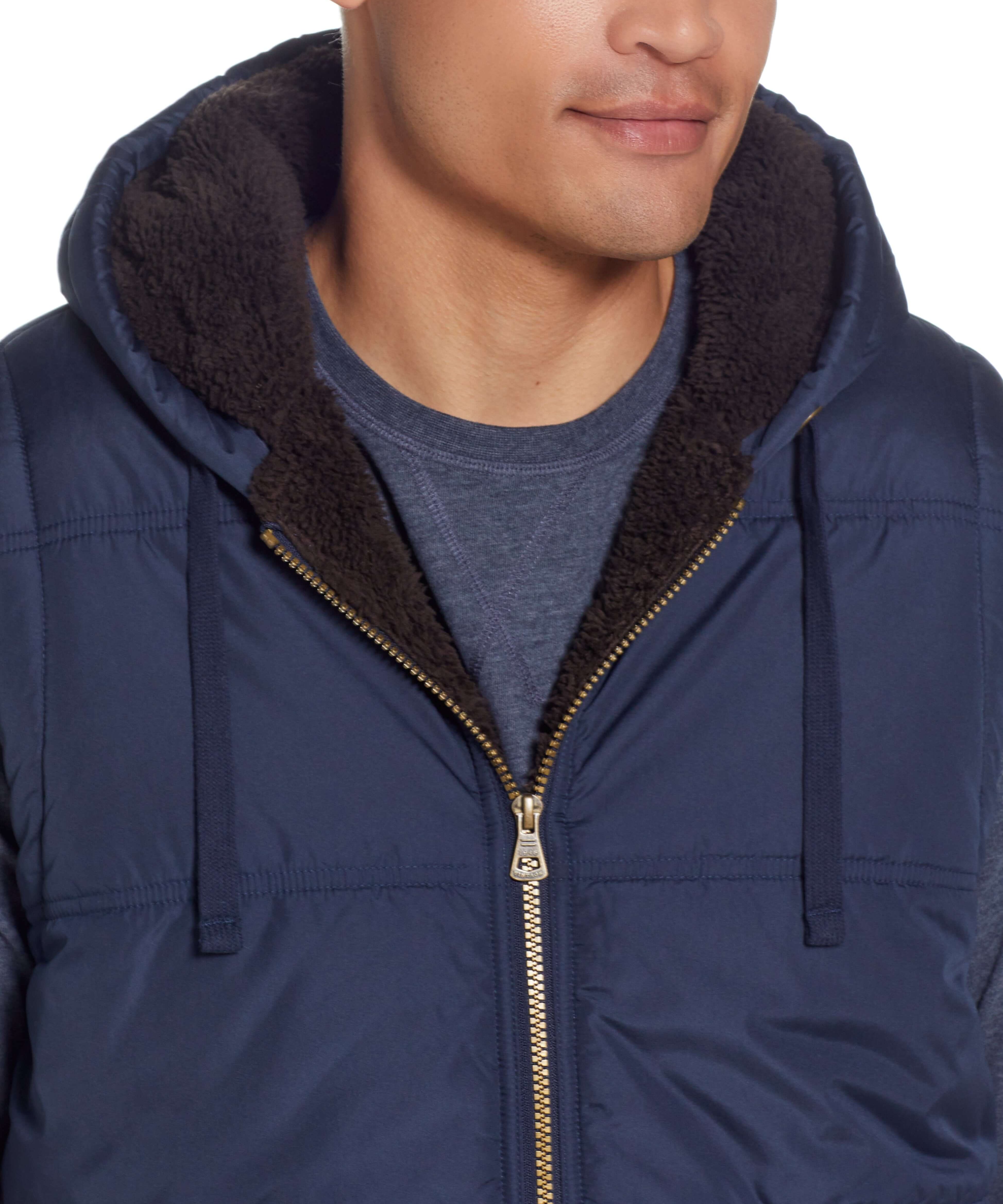 Sherpa Lined Hooded Puffer Vest In Dark Sapphire featuring soft sherpa lining and drawcord hood.