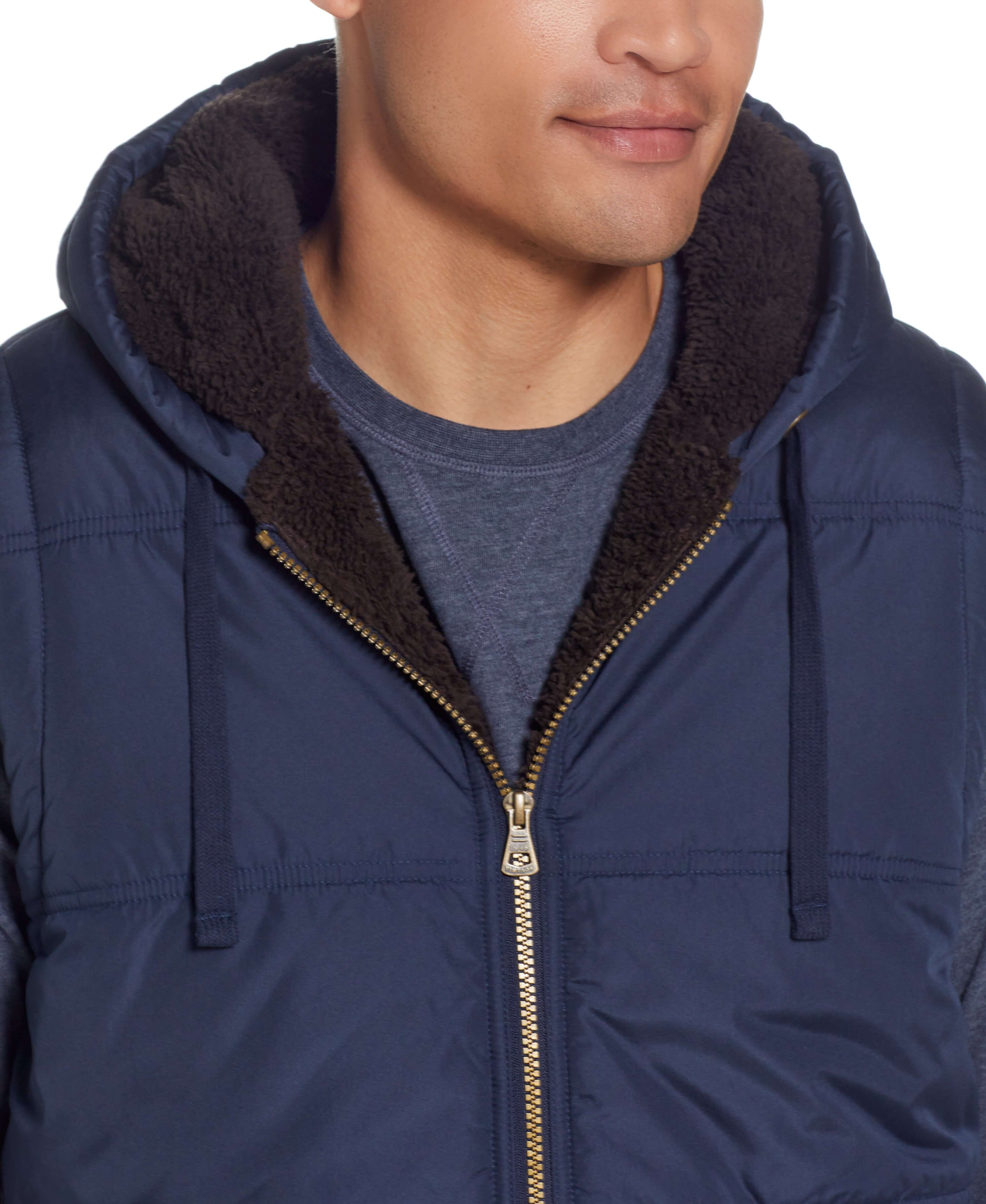 Sherpa Lined Hooded Puffer Vest In Dark Sapphire featuring soft sherpa lining and drawcord hood.