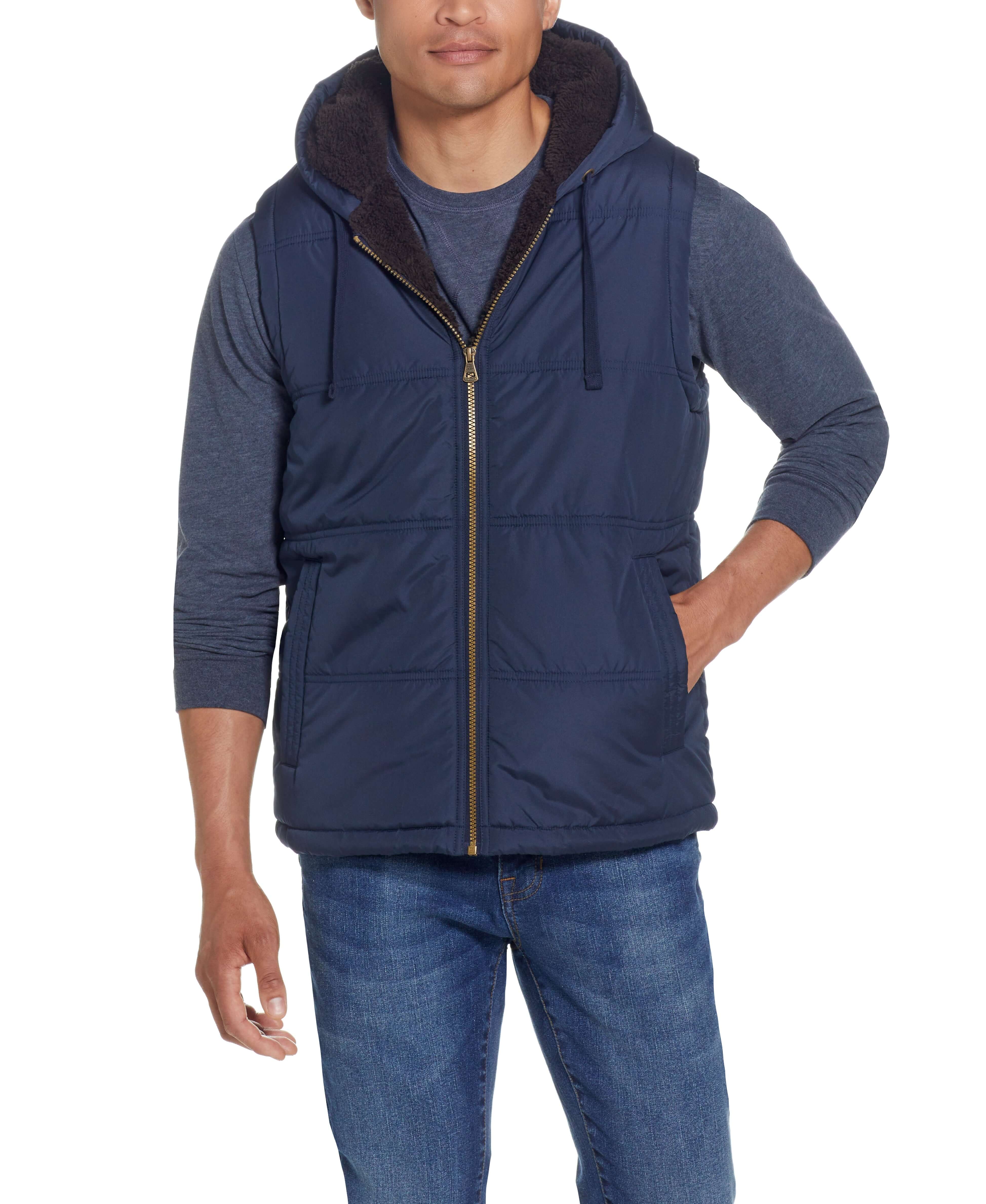 Sherpa Lined Hooded Puffer Vest In Dark Sapphire on model, showcasing cozy design and drawcord hood.