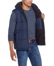 Sherpa Lined Hooded Puffer Vest In Dark Sapphire worn by a model showing cozy sherpa lining and side pockets.