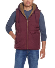 Sherpa Lined Hooded Puffer Vest In Port worn by model, showcasing cozy design and drawcord hood.