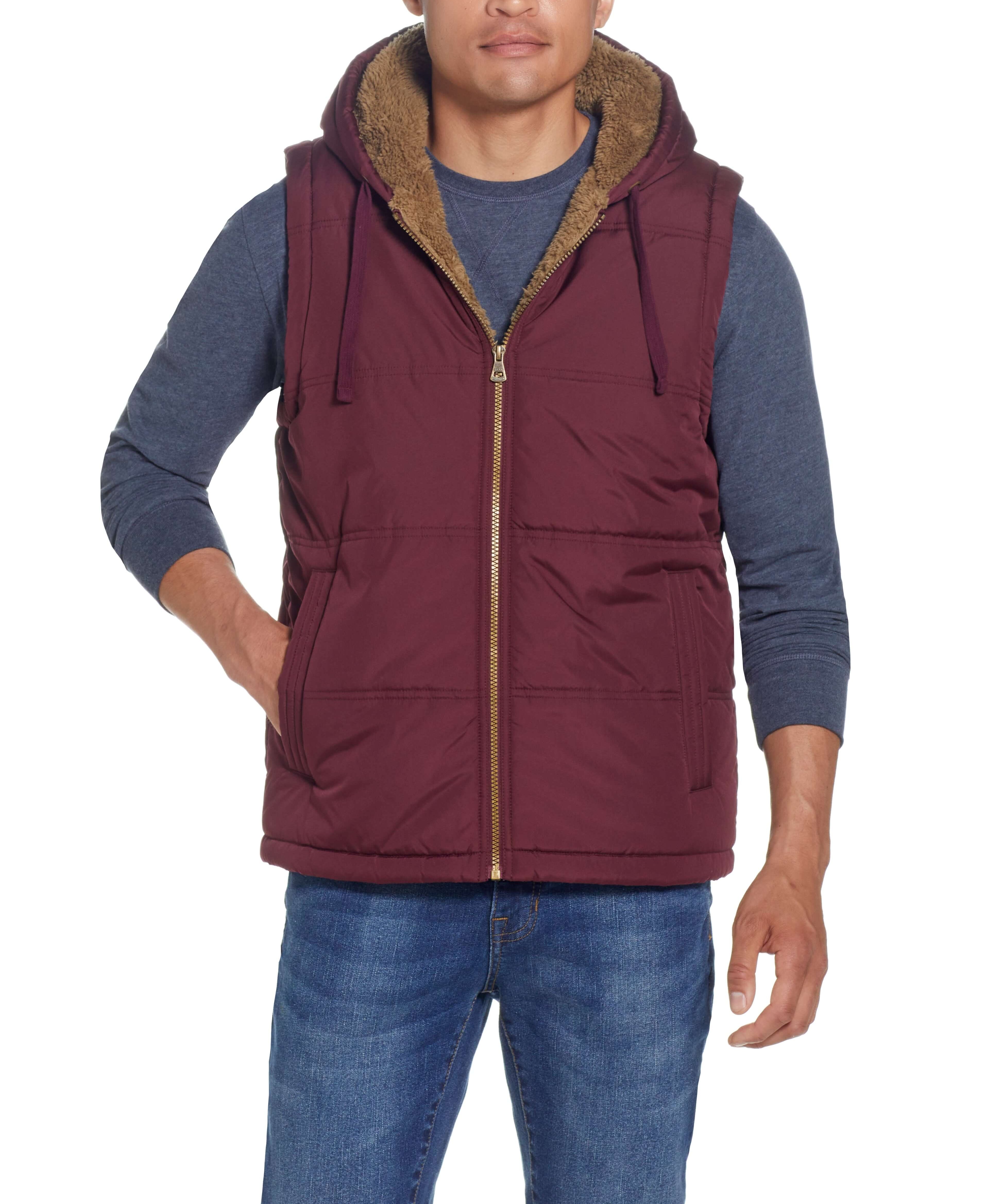 Sherpa Lined Hooded Puffer Vest In Port worn by model, showcasing cozy design and drawcord hood.