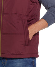 Sherpa Lined Hooded Puffer Vest In Port with side pocket detail and cozy interior.