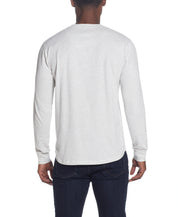 Back view of a model wearing the L/S BRUSHED JERSEY CREW in OATMEAL, showcasing its relaxed fit and long sleeves.