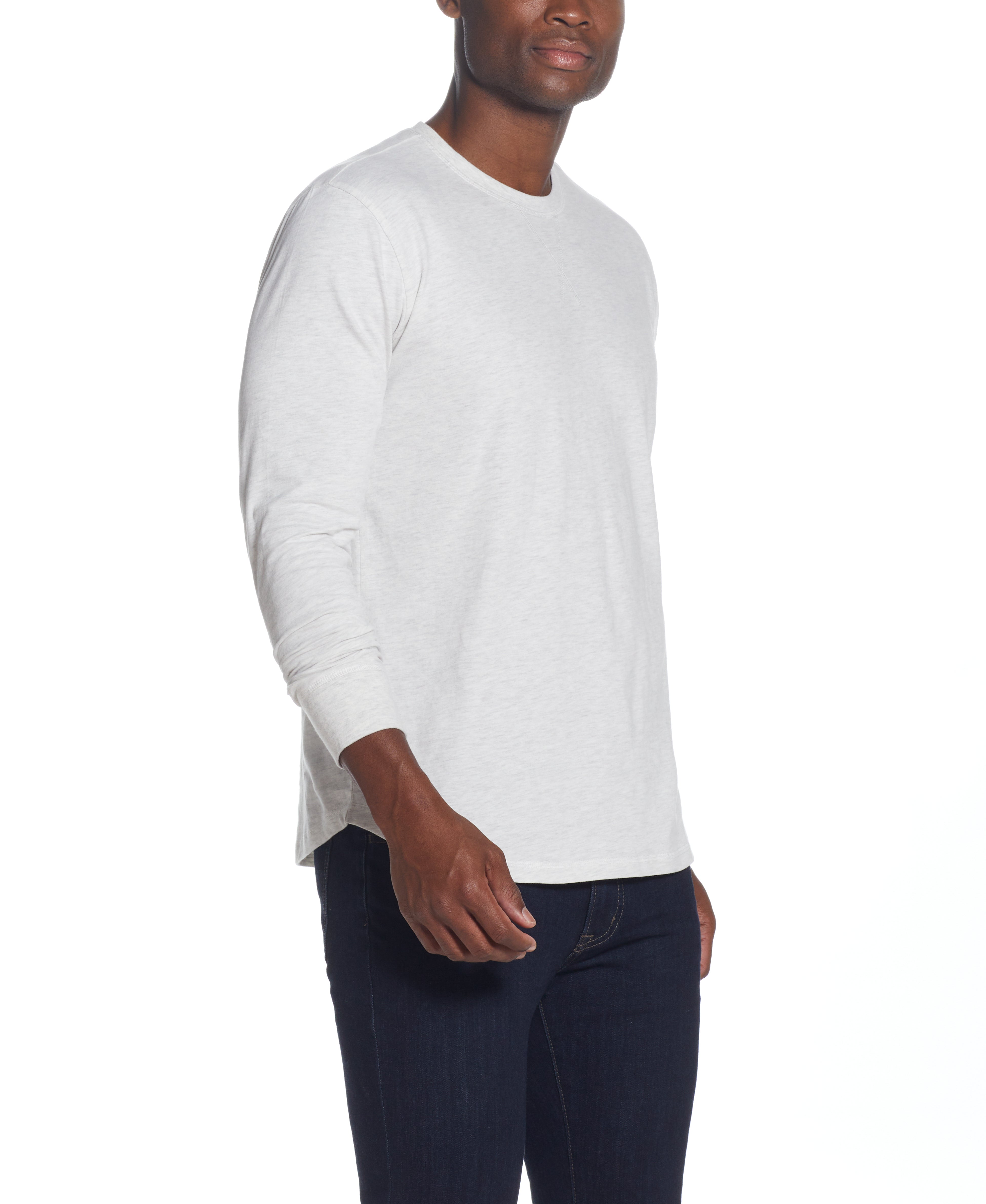 L/S BRUSHED JERSEY CREW in OATMEAL model wearing long sleeve pullover with crew neck and ribbed cuffs.