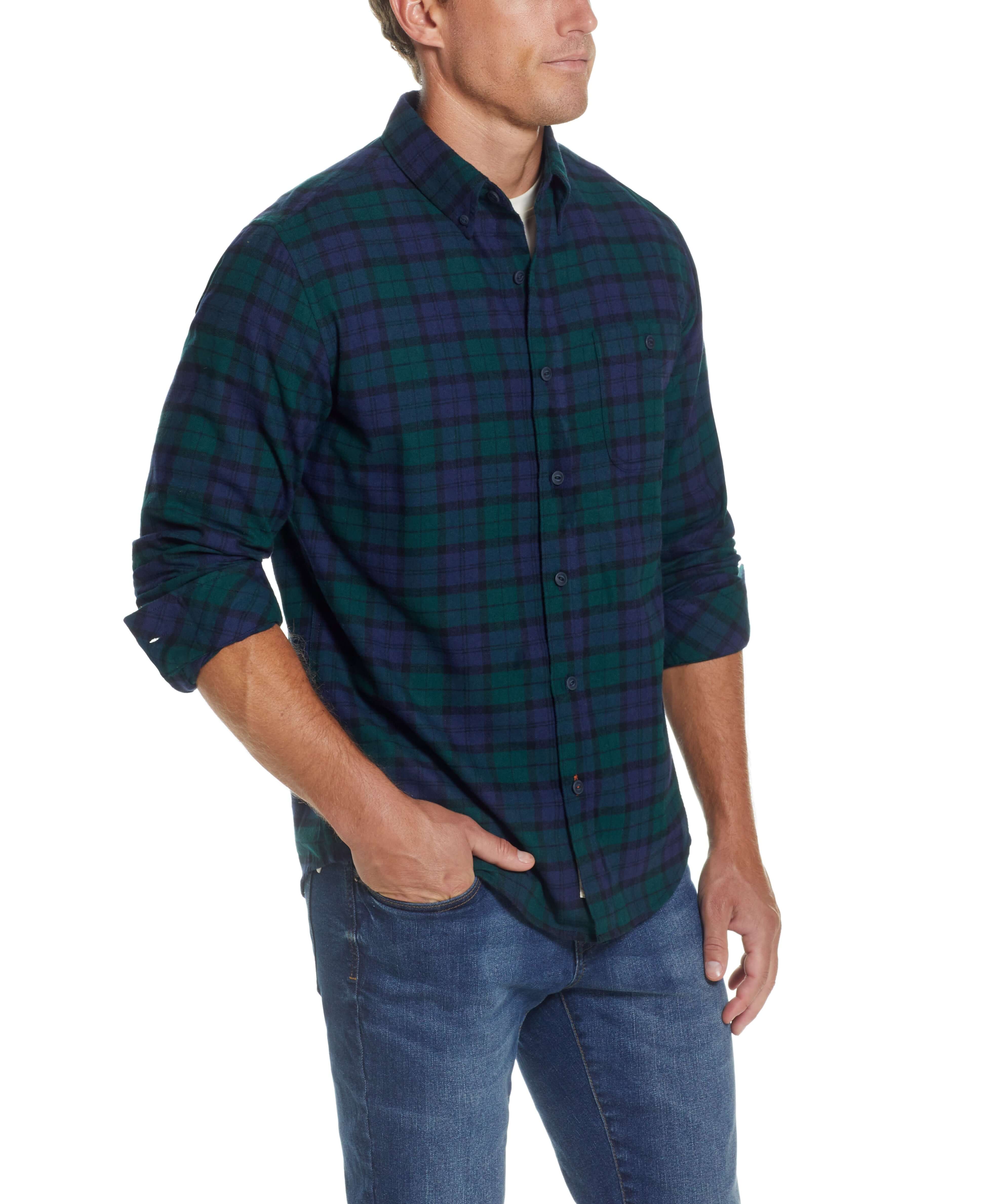 Model showcasing the Holiday Antique Flannel Shirt In Deep Sea, featuring a relaxed fit, button front, and soft brushed fabric.