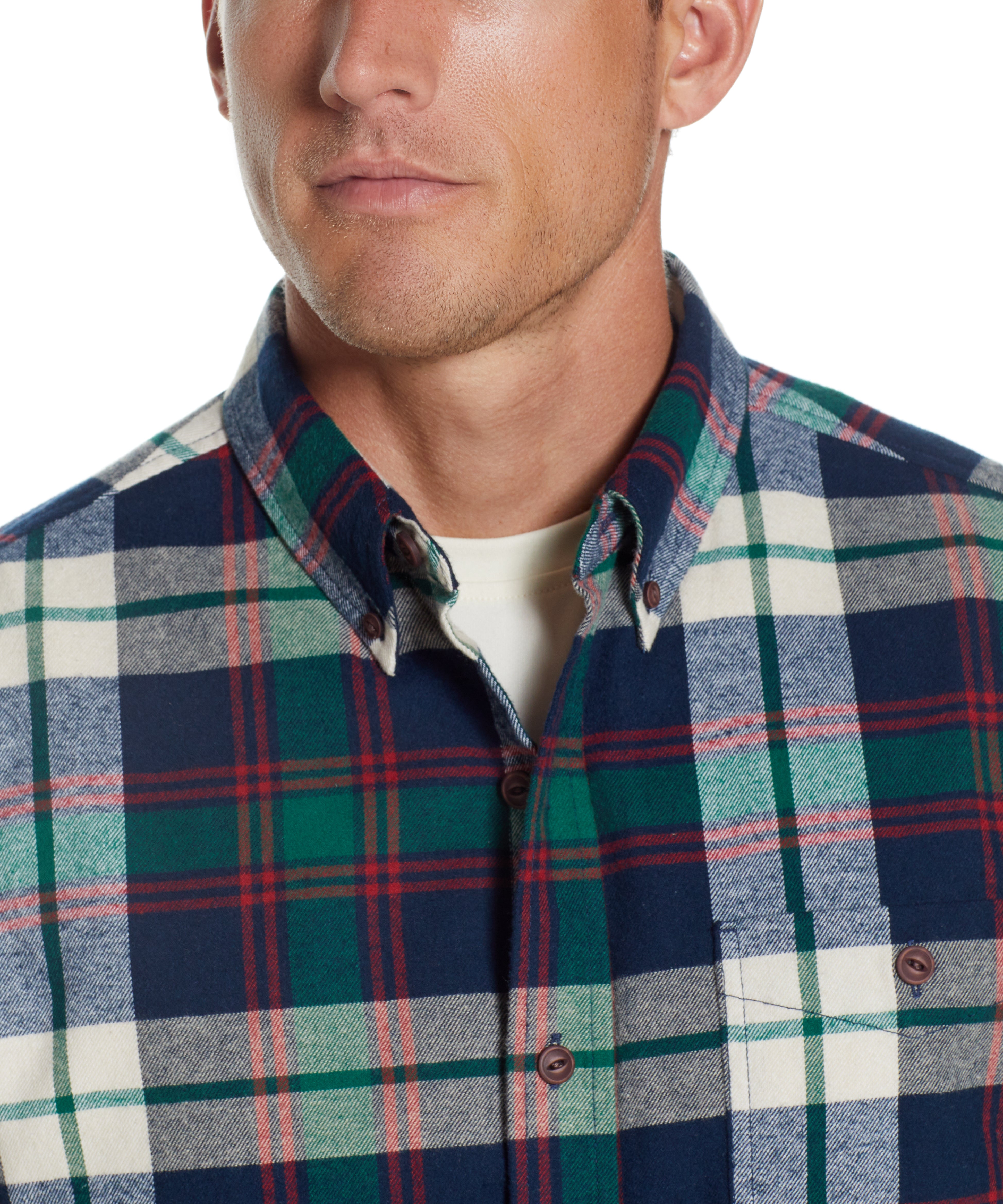 Holiday Antique Flannel Shirt In Duffel Bag close-up of man wearing plaid shirt with button-down collar.