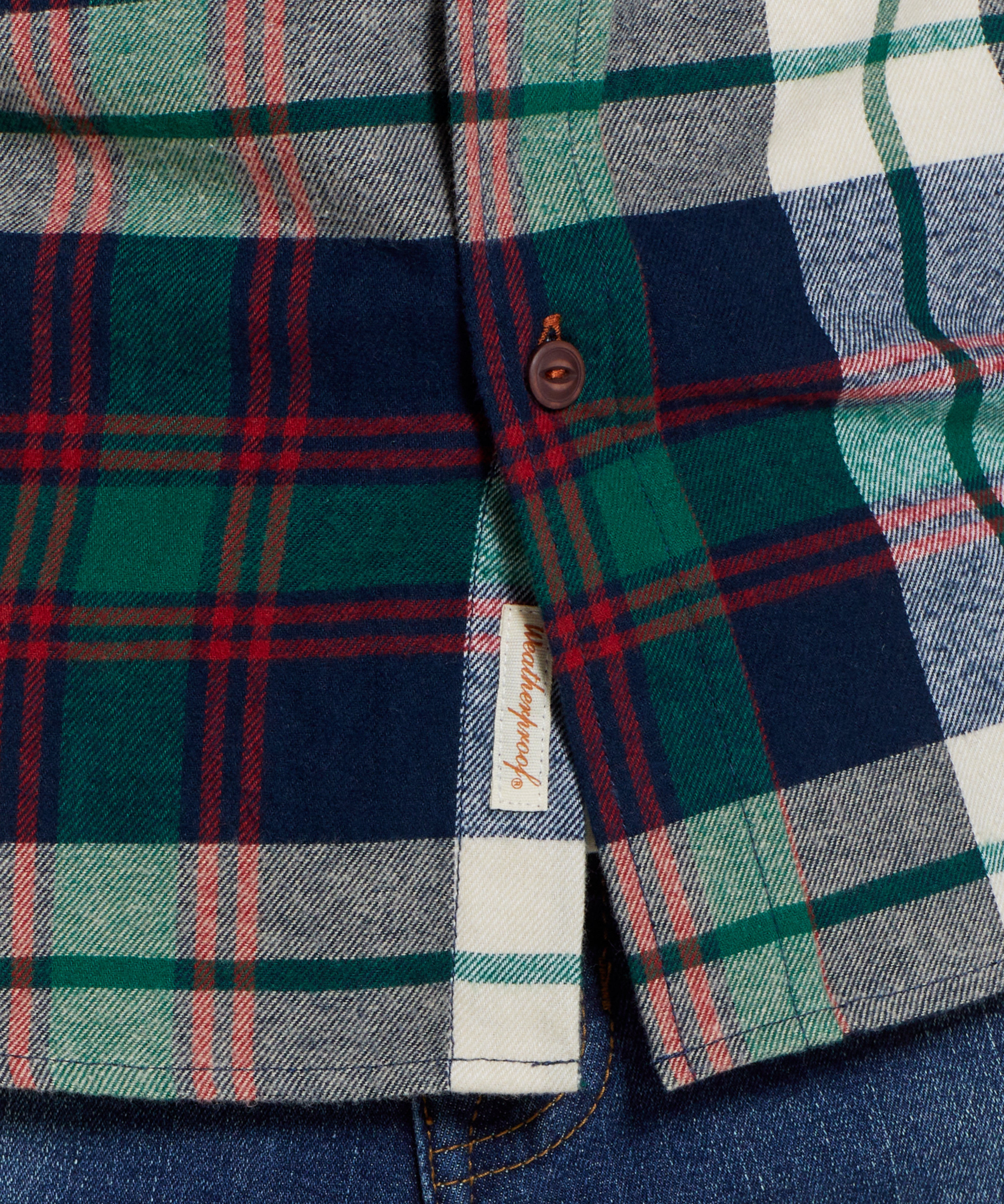 Holiday Antique Flannel Shirt In Duffel Bag close-up showing plaid pattern and button detail