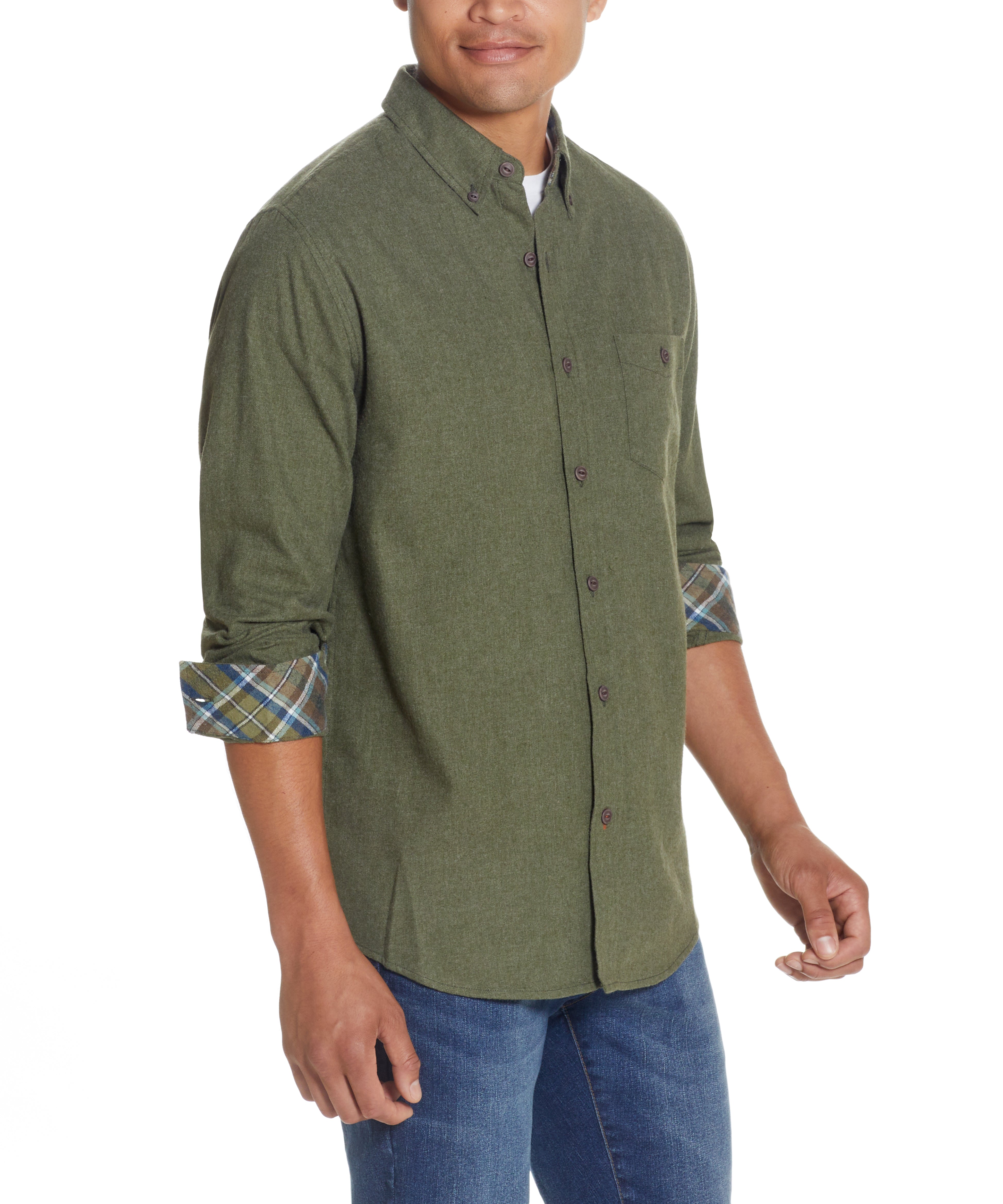 Model wearing BRUSHED ANTIQUE SOLID FLANNEL SHIRT in DEEP OLIVE with rolled sleeves and button front.