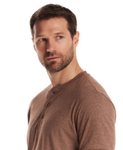Model wearing a short sleeve microstripe henley in cappuccino, showcasing the rib collar and button placket.
