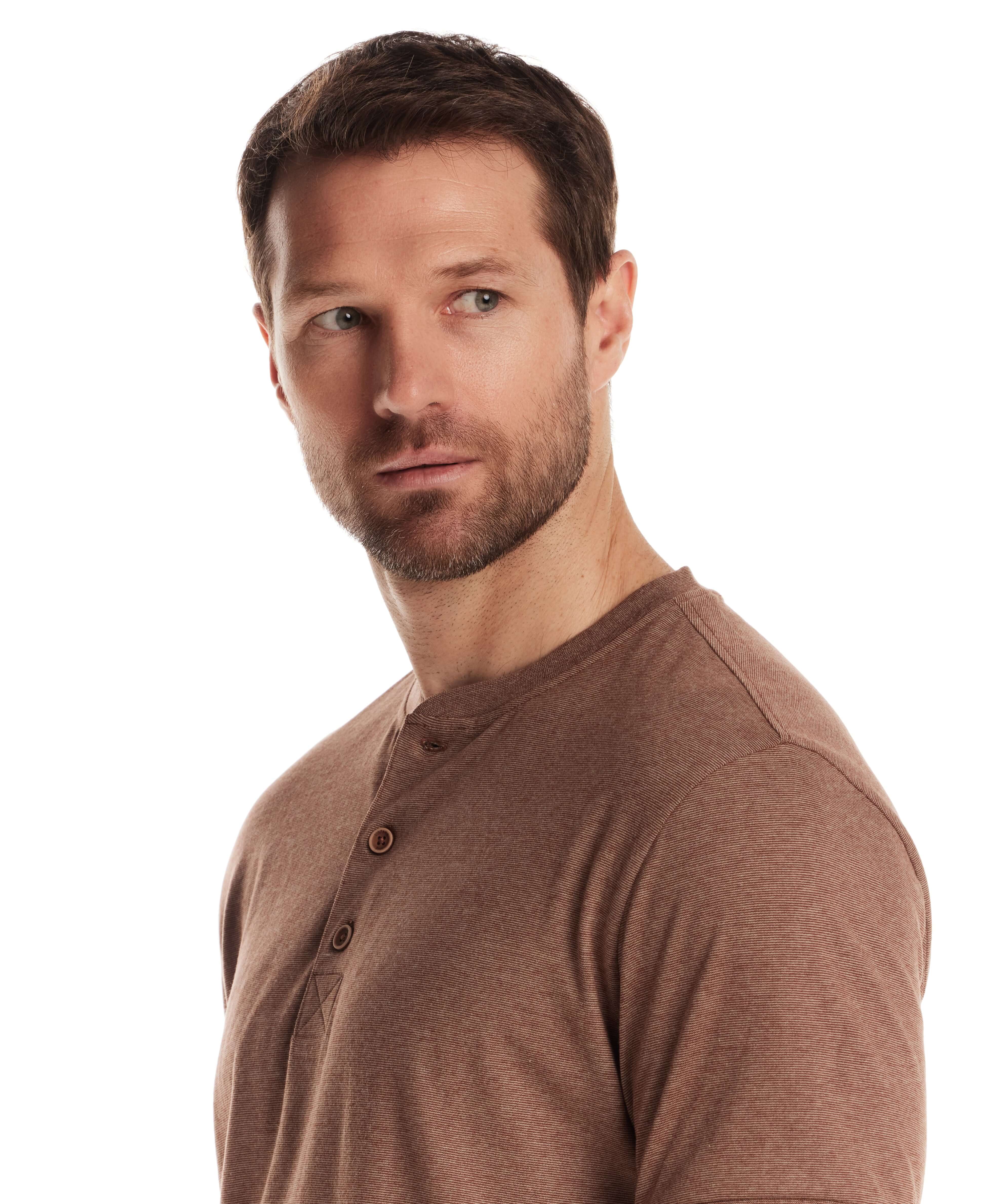 Model wearing a short sleeve microstripe henley in cappuccino, showcasing the rib collar and button placket.