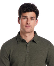 Man in Kambaba Olive Short Sleeve Stretch Waffle Polo with three-button placket and classic collar.