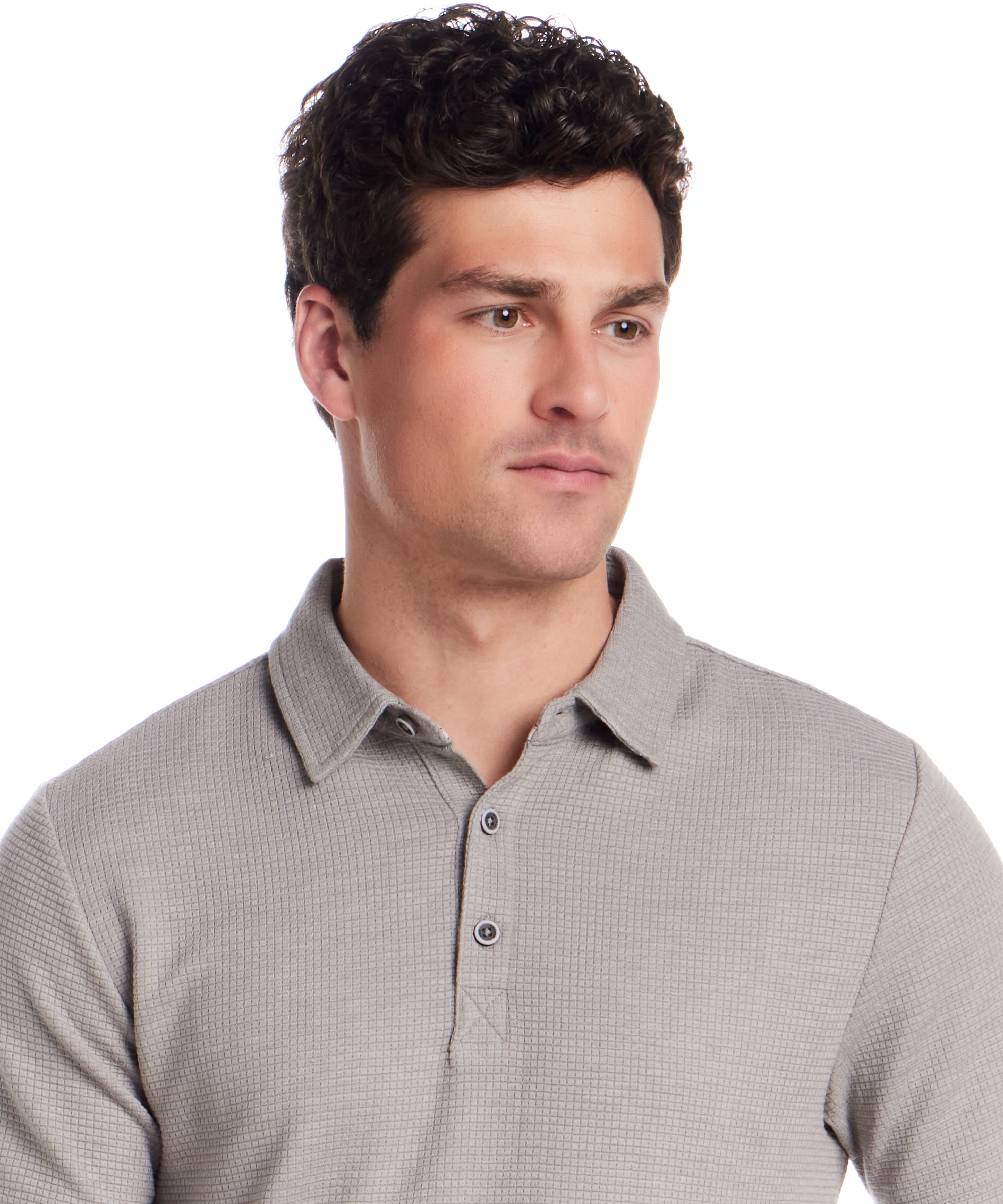 Man wearing a short sleeve stretch waffle polo in Ultimate Grey with a classic collar and three-button placket.