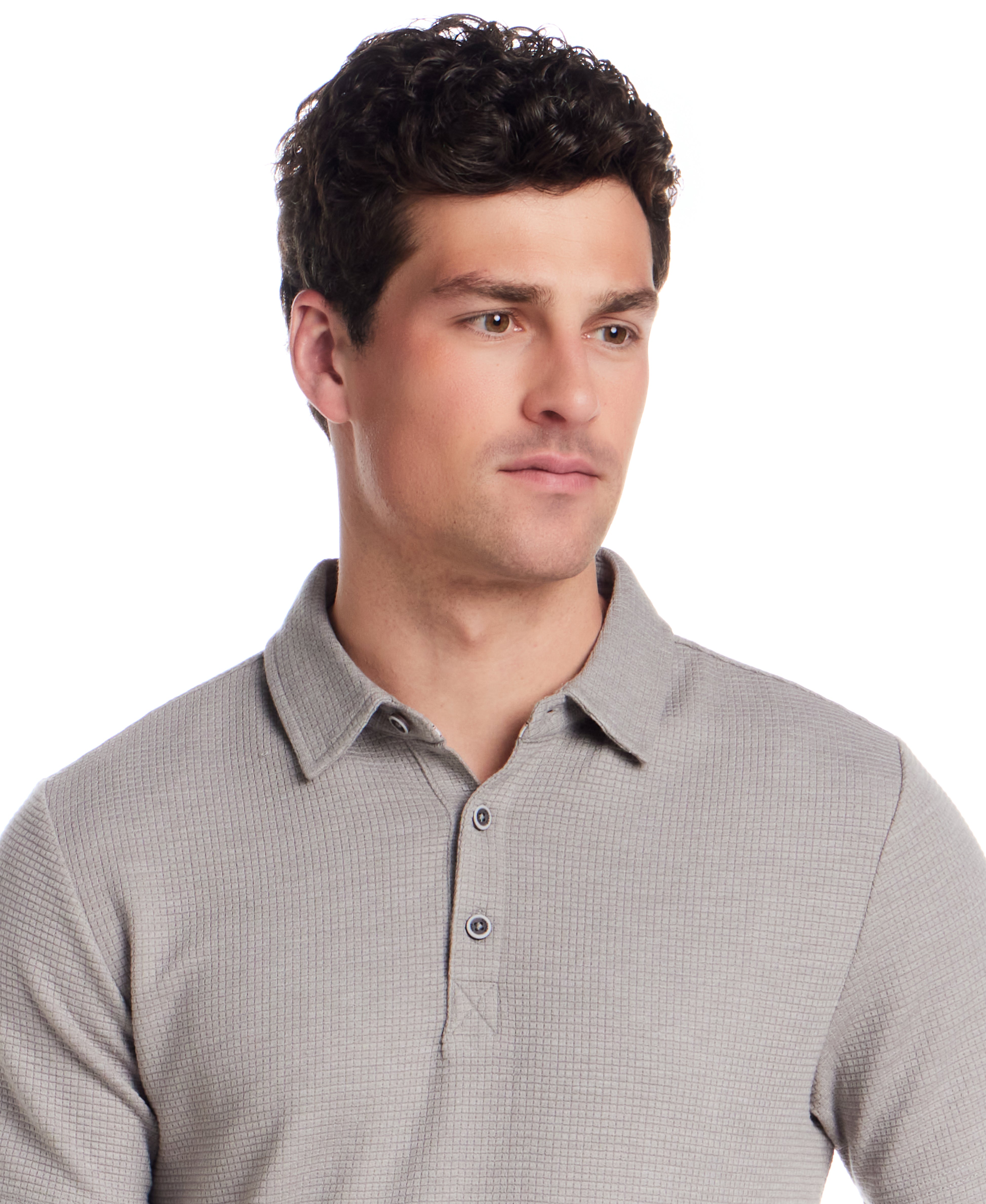 Man wearing a short sleeve stretch waffle polo in Ultimate Grey with a classic collar and three-button placket.