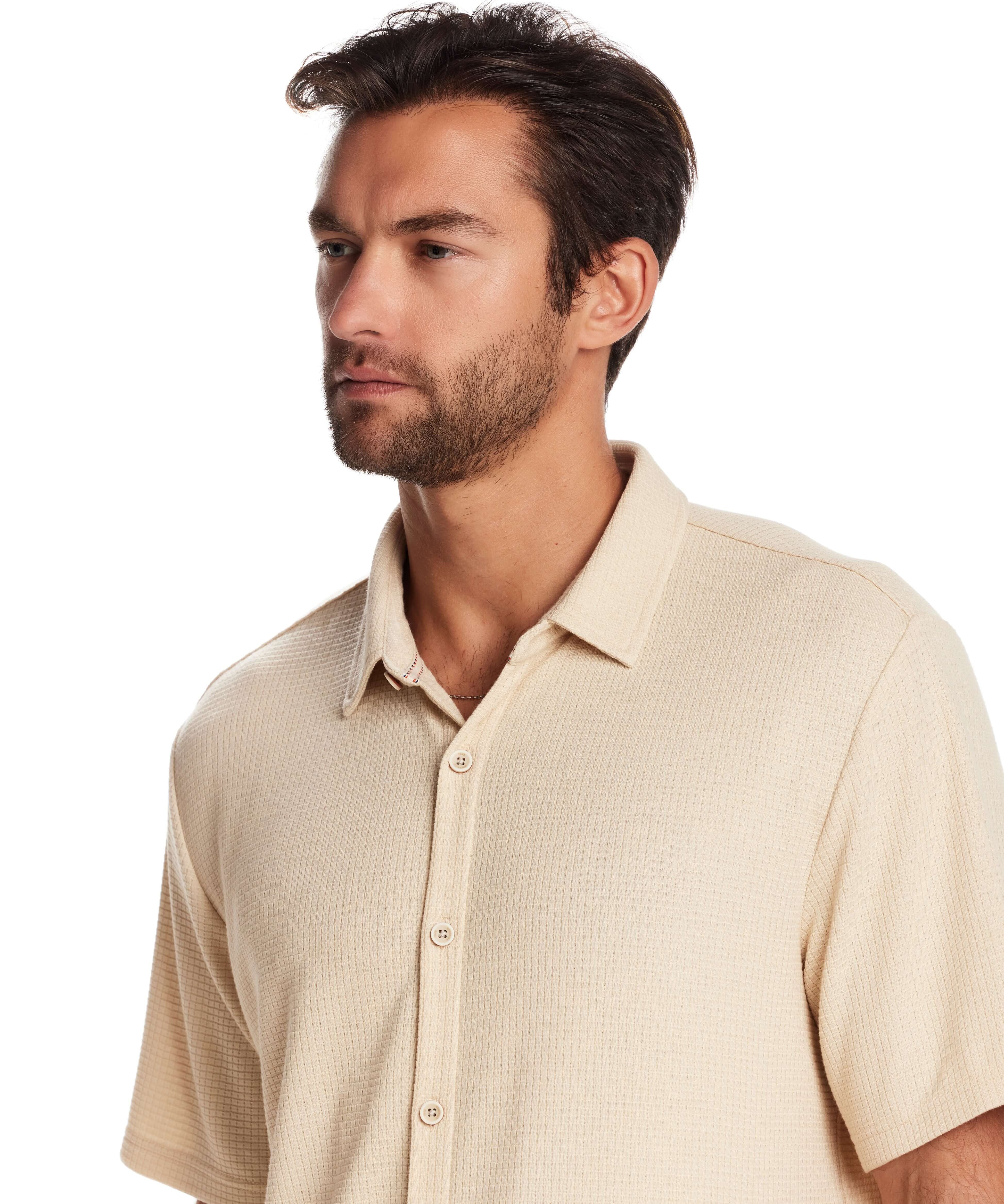 Model wearing a natural short sleeve waffle coat front tee, showcasing the button-front design and relaxed fit.