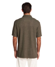 Back view of a man wearing a short sleeve olive heather waffle knit shirt, showcasing a relaxed fit and collar detail.