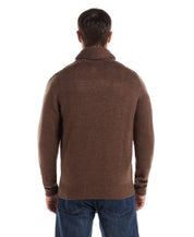 Man wearing a Fisherman Shawl Collar Aran Cable Pullover in Flagstone, showcasing the back view and relaxed fit.