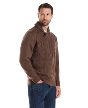 Man wearing Fisherman Shawl Collar Aran Cable Pullover in Flagstone, showcasing classic fit and vintage details.
