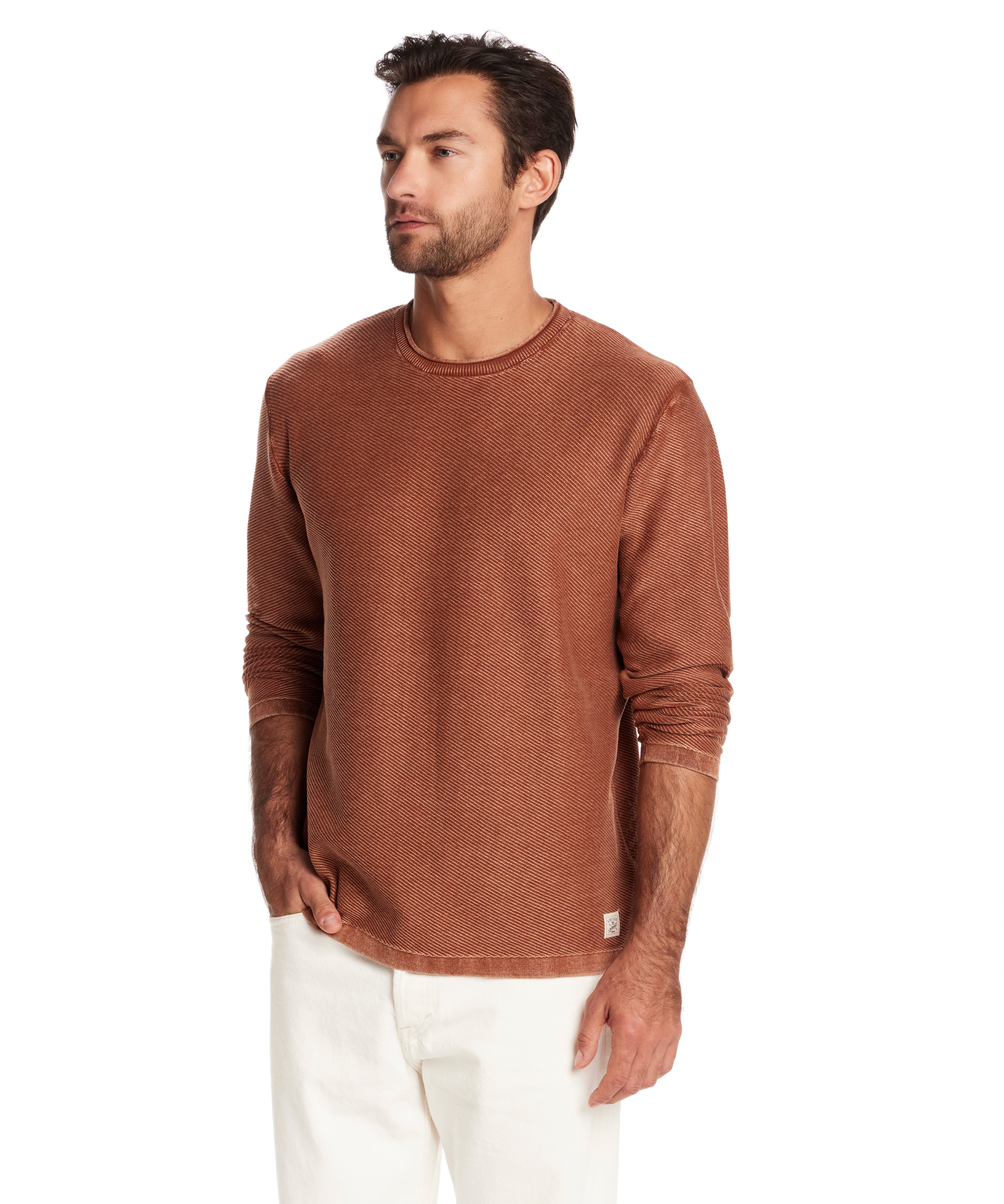 Man wearing a twill stonewash sweater in gingerbread, showcasing its classic roll-neck and soft texture.