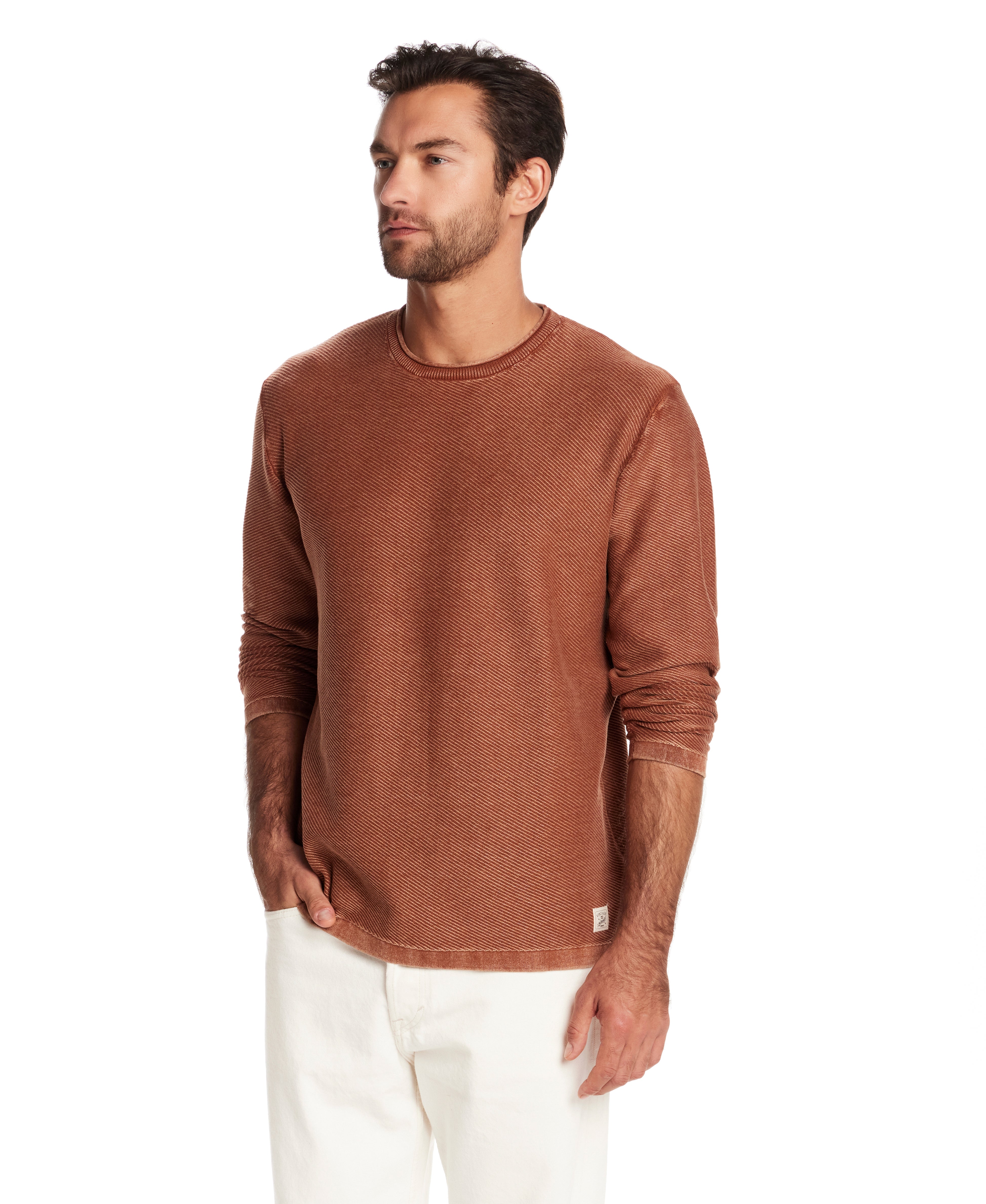 Man wearing a twill stonewash sweater in gingerbread, showcasing its classic roll-neck and soft texture.