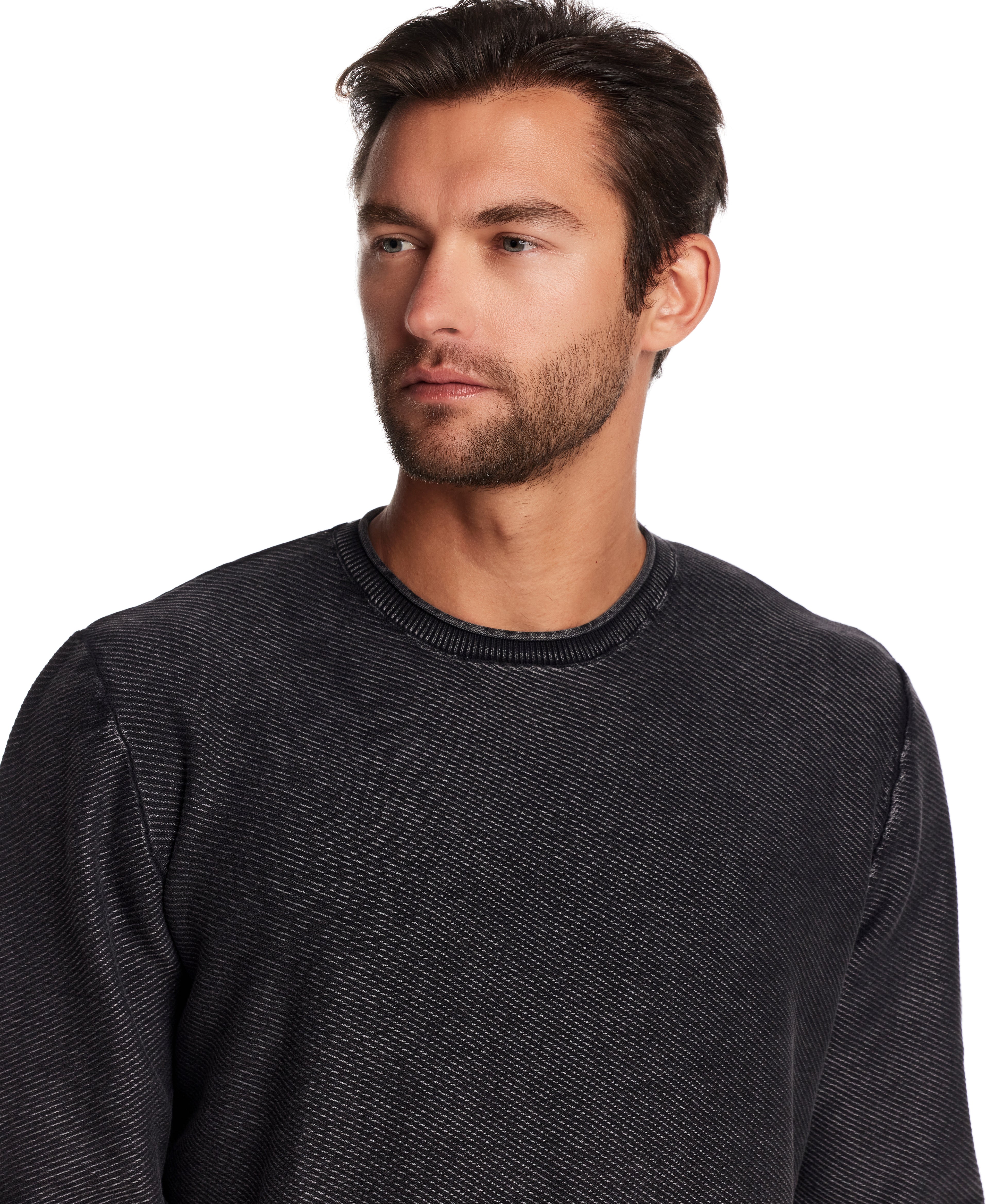 Model wearing a Twill Stonewash Sweater in Meteorite, showcasing its classic roll-neck design and textured knit.