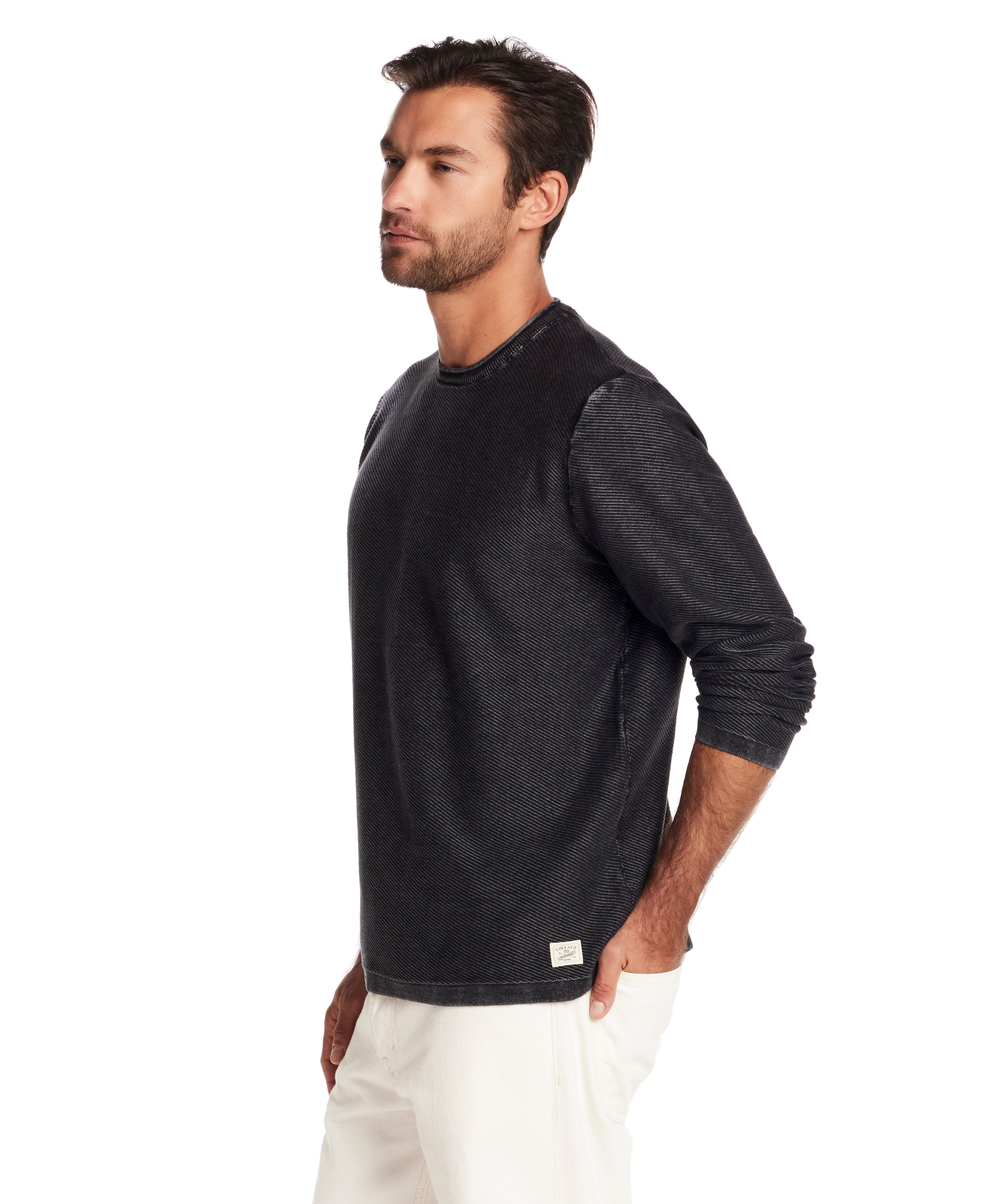 Model wearing a Twill Stonewash Sweater in Meteorite, showcasing its classic roll-neck design and relaxed fit.