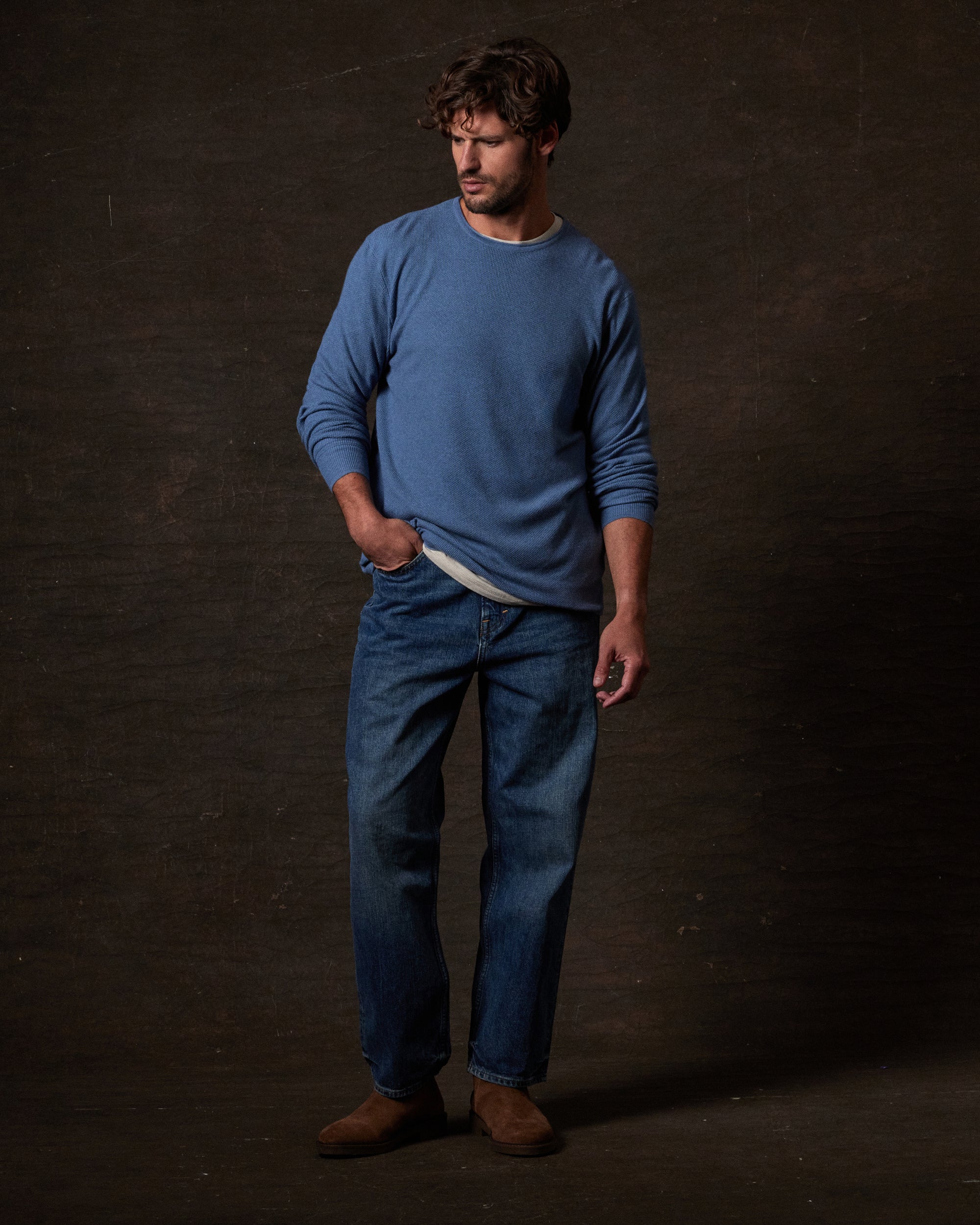Textured Roll Neck Sweater in Blue Ashes worn with jeans, highlighting a modern cold-weather outfit for casual styling.