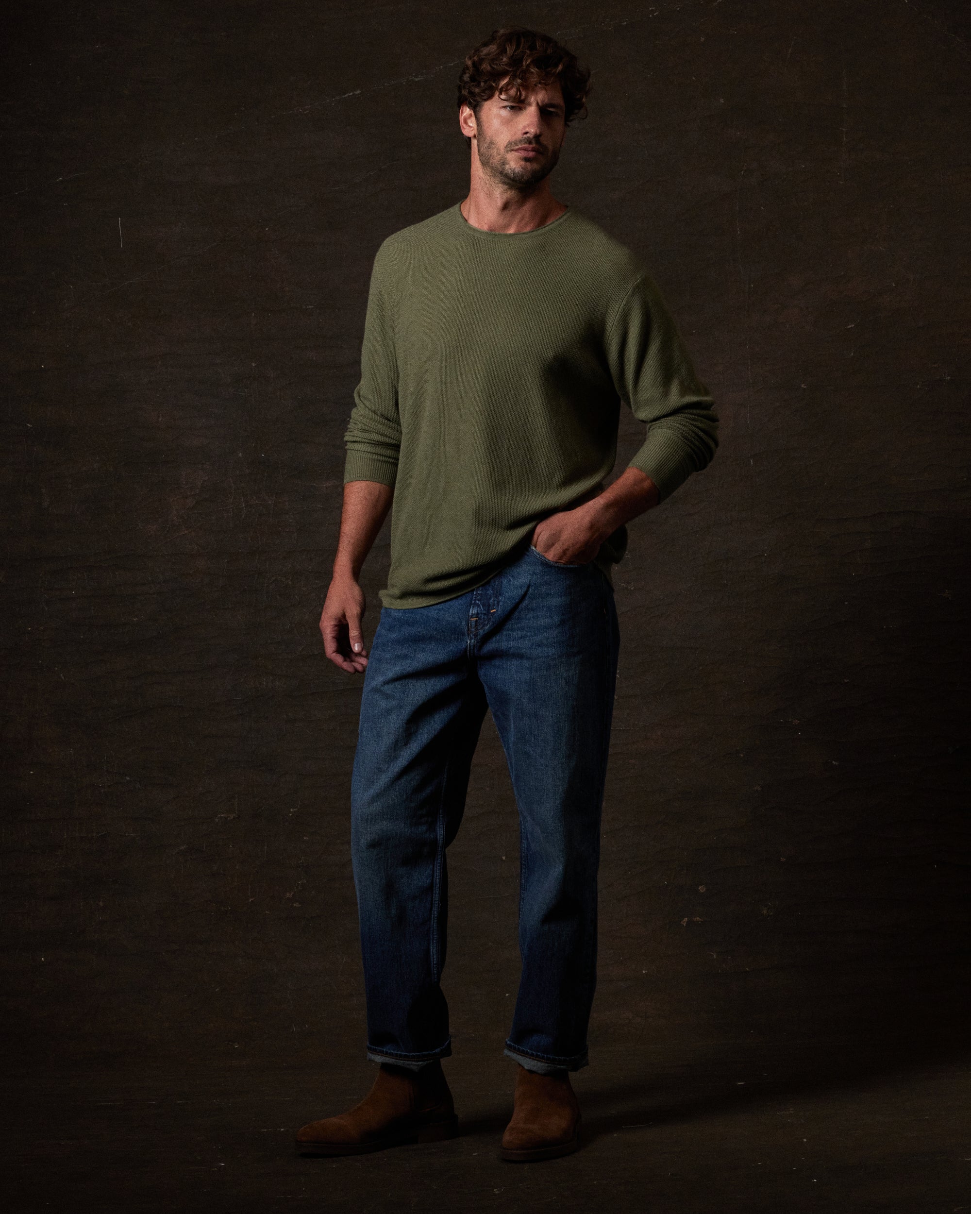 Textured Roll Neck Sweater in Tea Leaf worn with blue jeans, styled for modern cold-weather fashion.