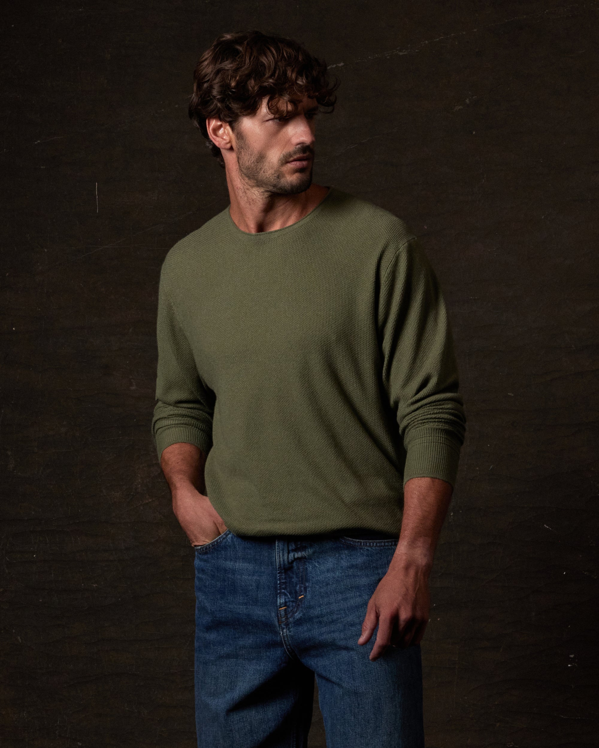 Textured Roll Neck Sweater in Tea Leaf worn by model, showcasing modern style and comfort in a soft knit fabric.