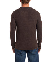 Back view of a man wearing a chocolate torte soft touch vertical stitch sweater with a classic fit and four-button placket.