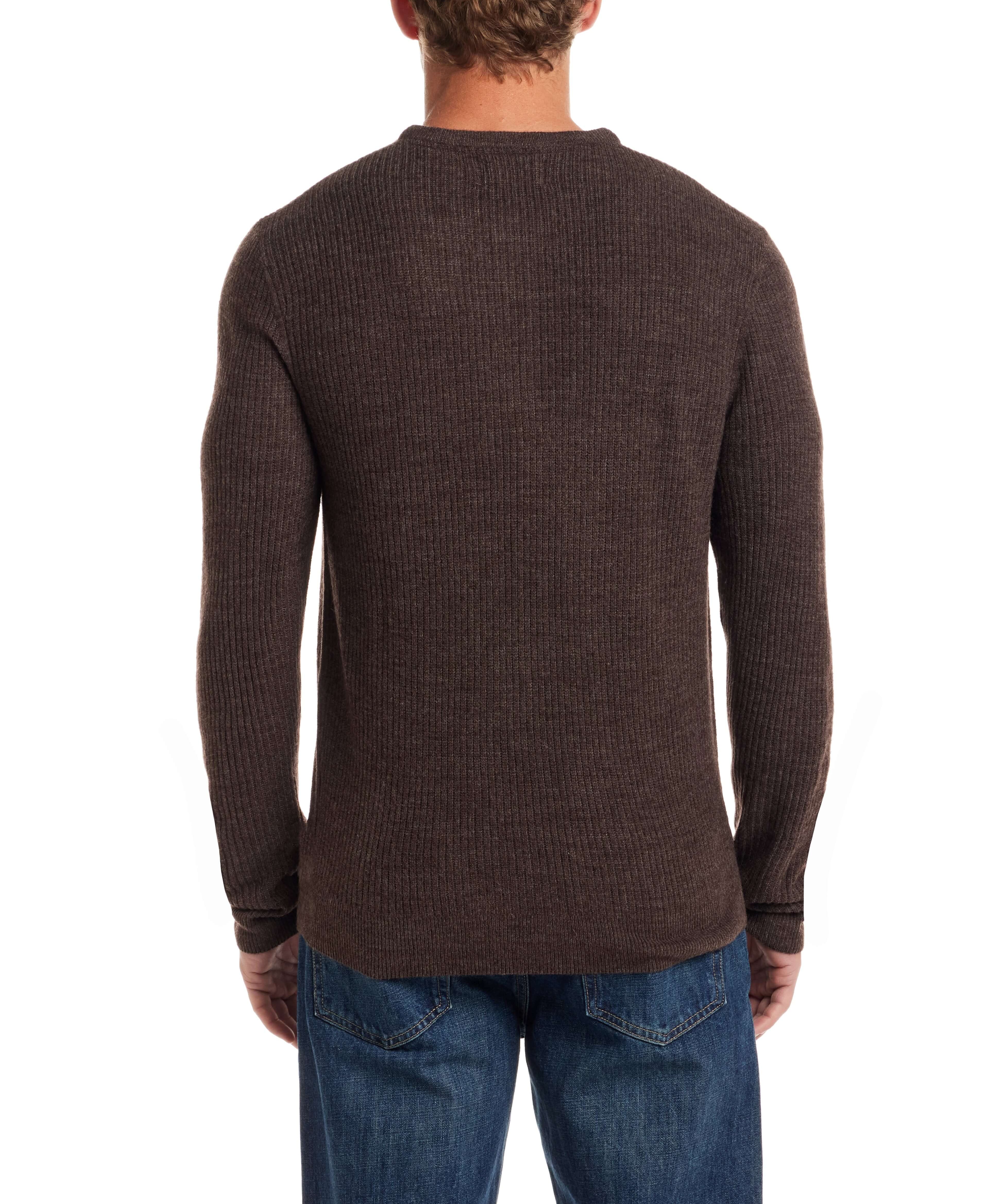 Back view of a man wearing a chocolate torte soft touch vertical stitch sweater with a classic fit and four-button placket.