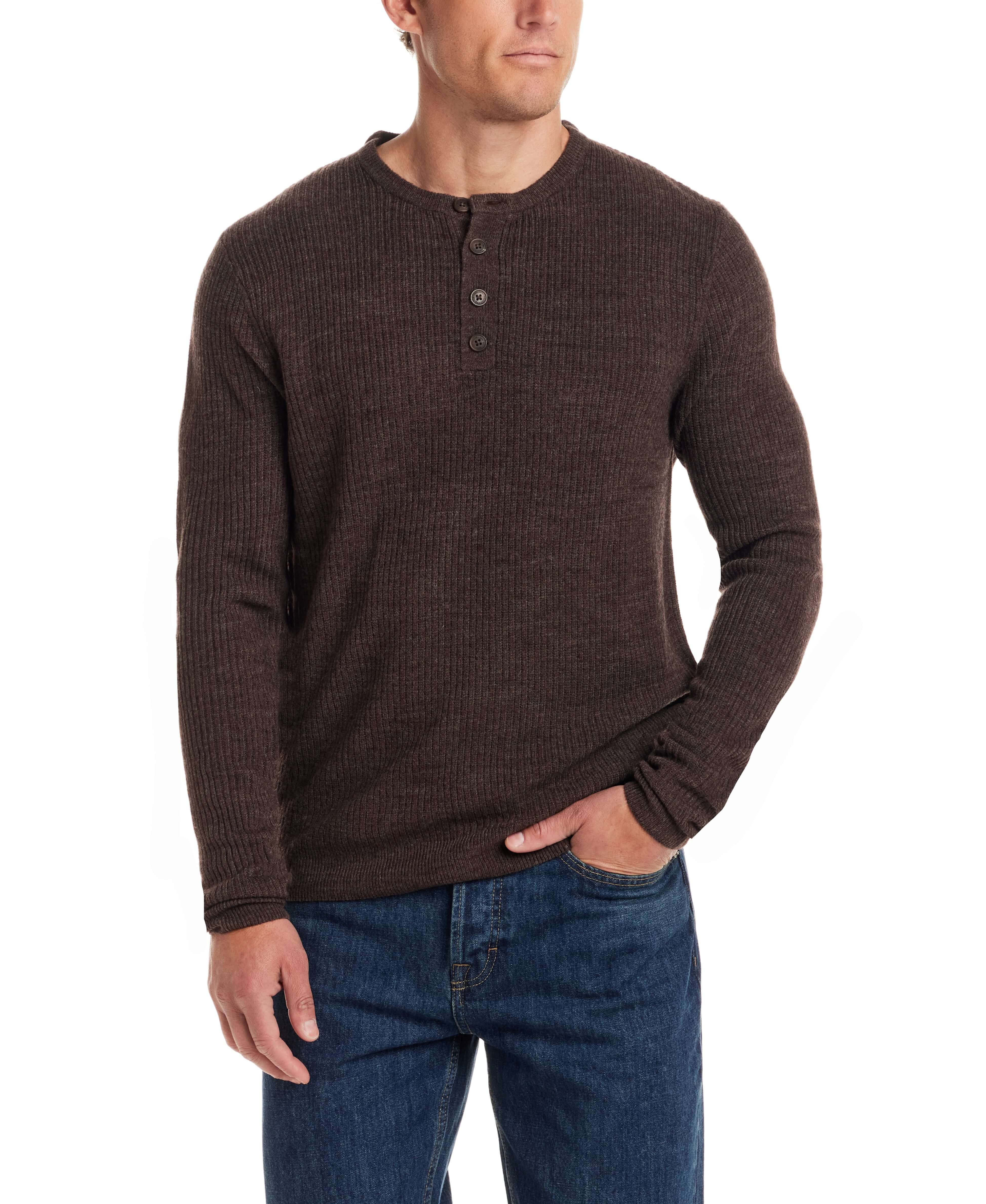 Man wearing a chocolate torte soft touch vertical stitch sweater with a four-button placket, paired with denim jeans.