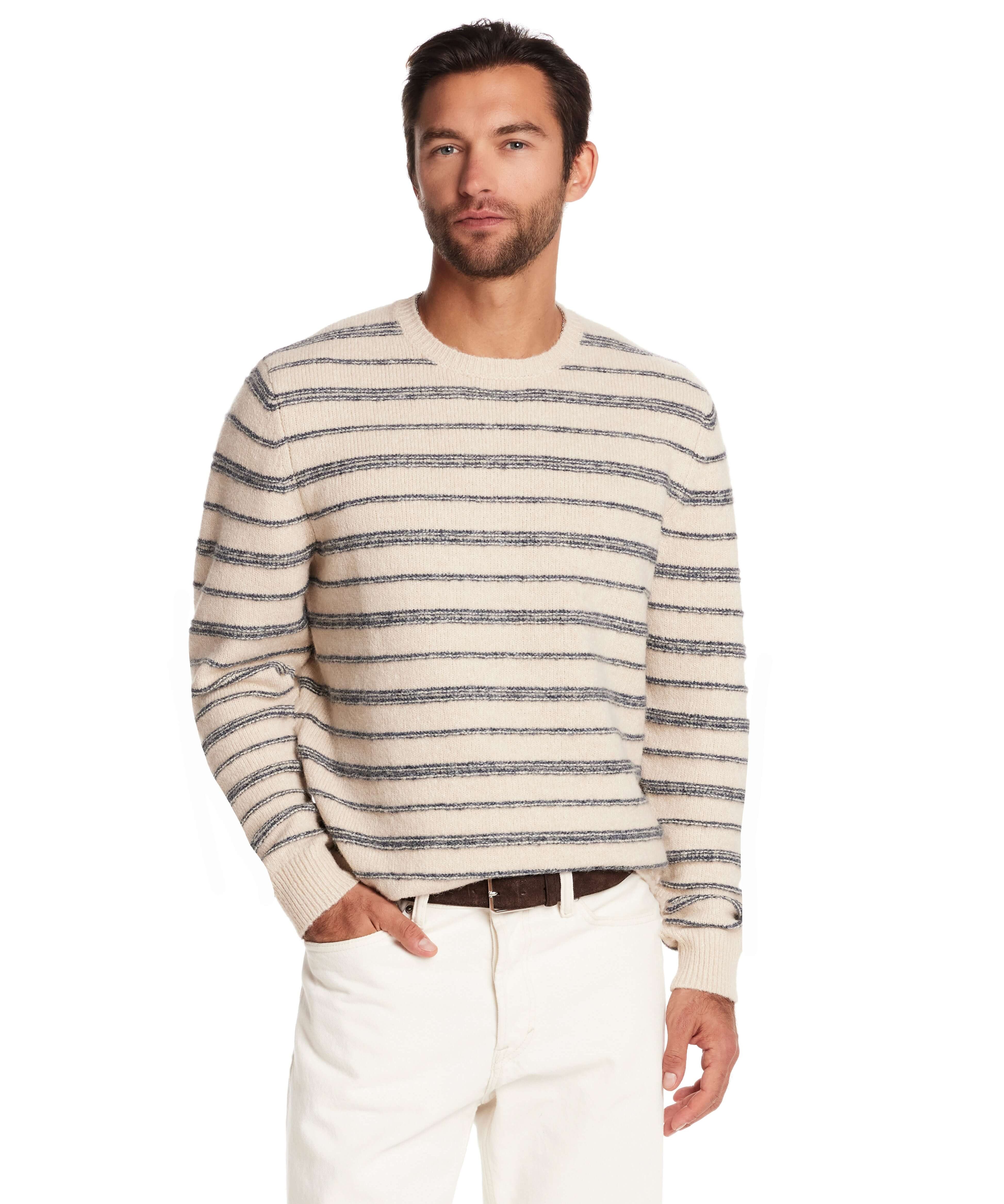 Model wearing a fuzzy striped crew sweater in cream and blue, showcasing a classic yet casual design for cool-weather style.