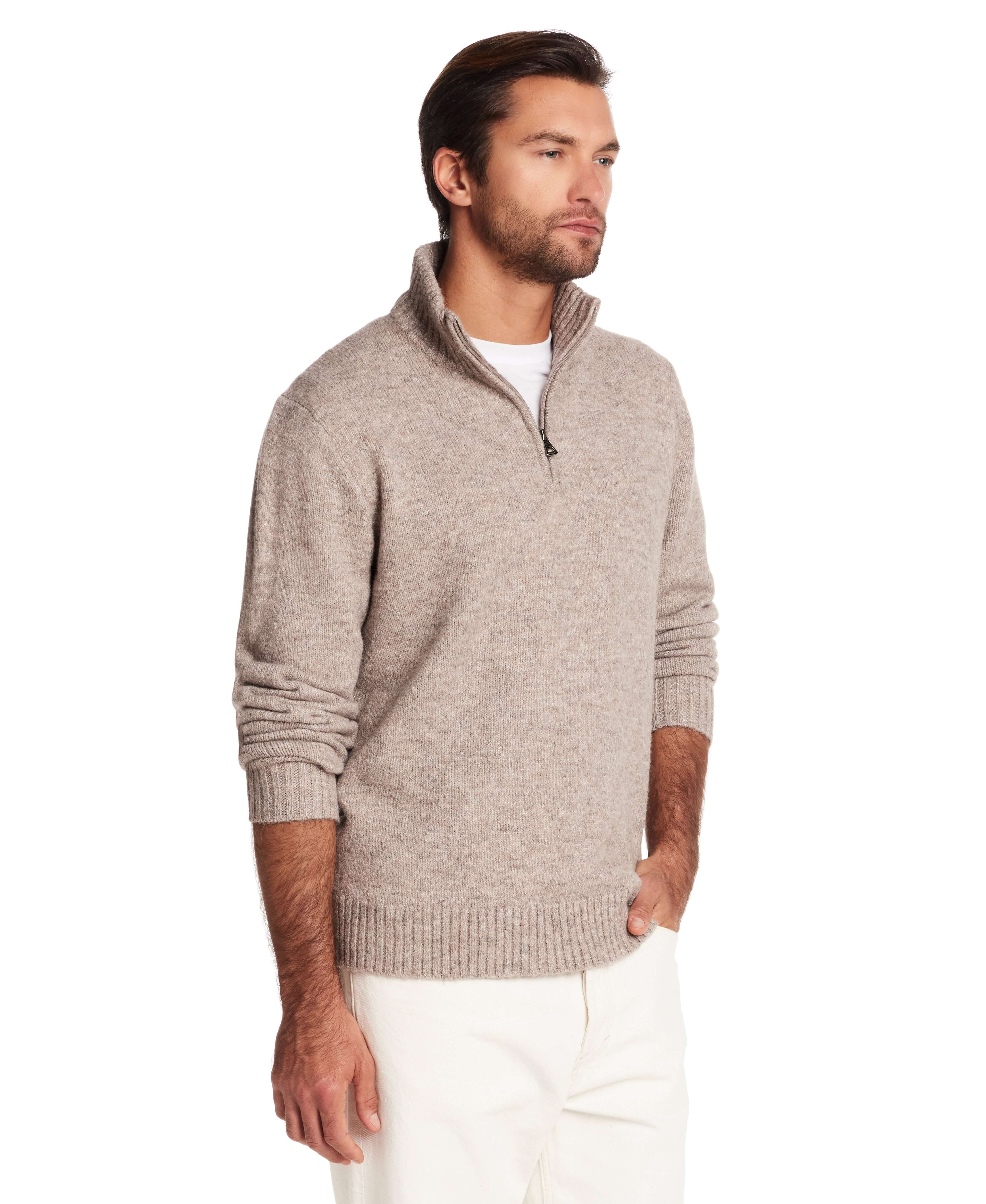 Fuzzy quarter zip sweater in taupe on a man, showcasing a soft feel, mock neck, and ribbed cuffs for modern styling.