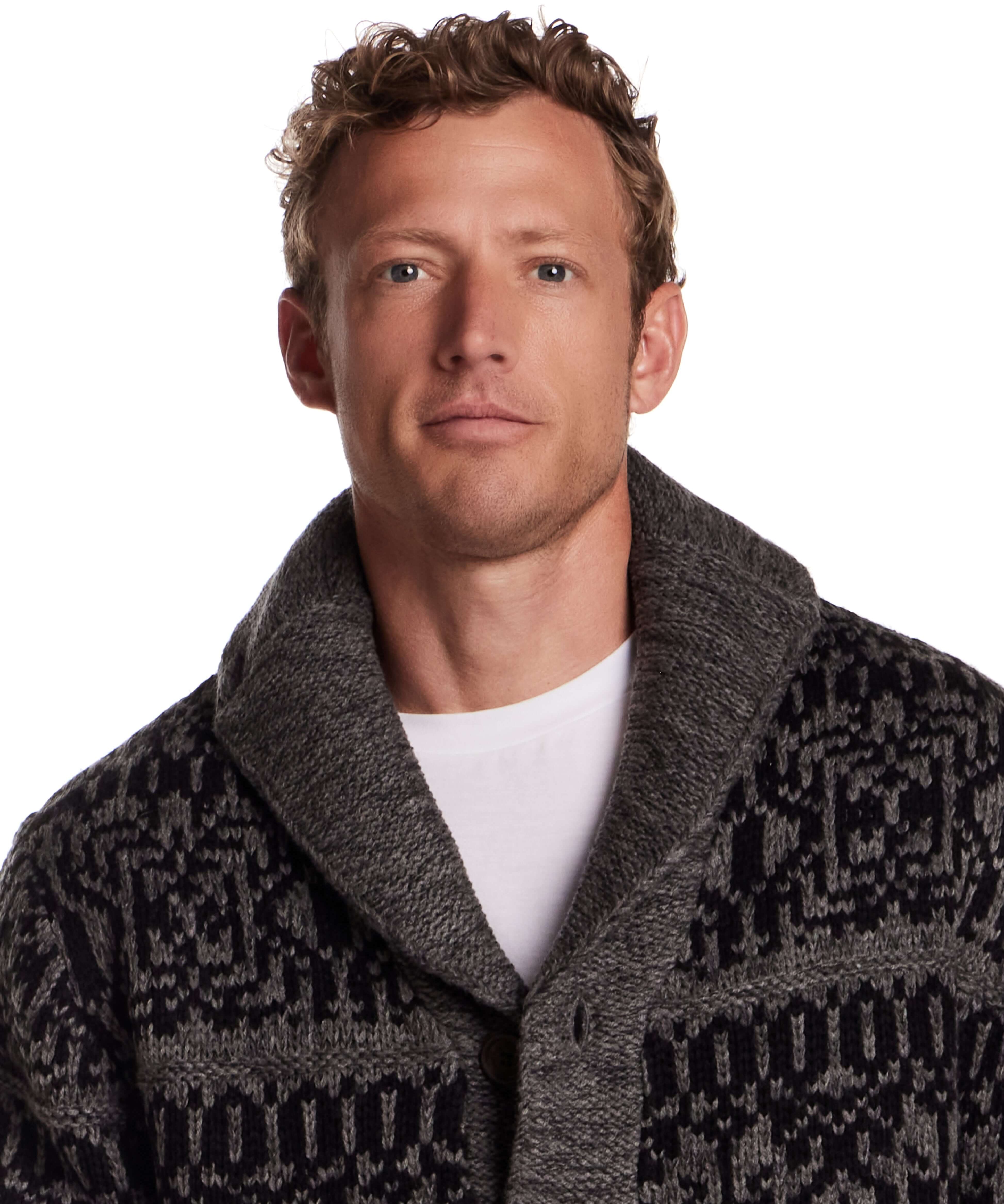 Man wearing a charcoal shawl collar sweater jacket featuring a textured knit and button closure.
