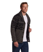 Man wearing a charcoal shawl collar sweater jacket with button closure and textured knit, styled for a classic look.